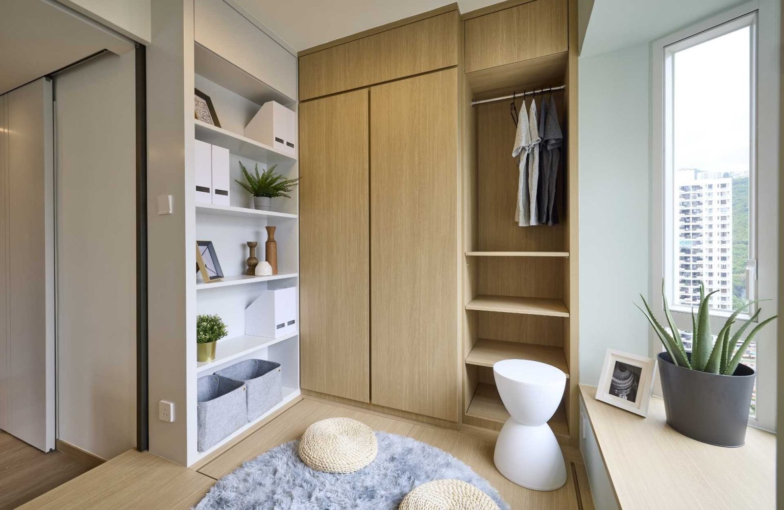 Raised wood platforms, integrated bedside tables, plant displays, and built-in storage create a warm and practical bedroom that makes the most of every inch.