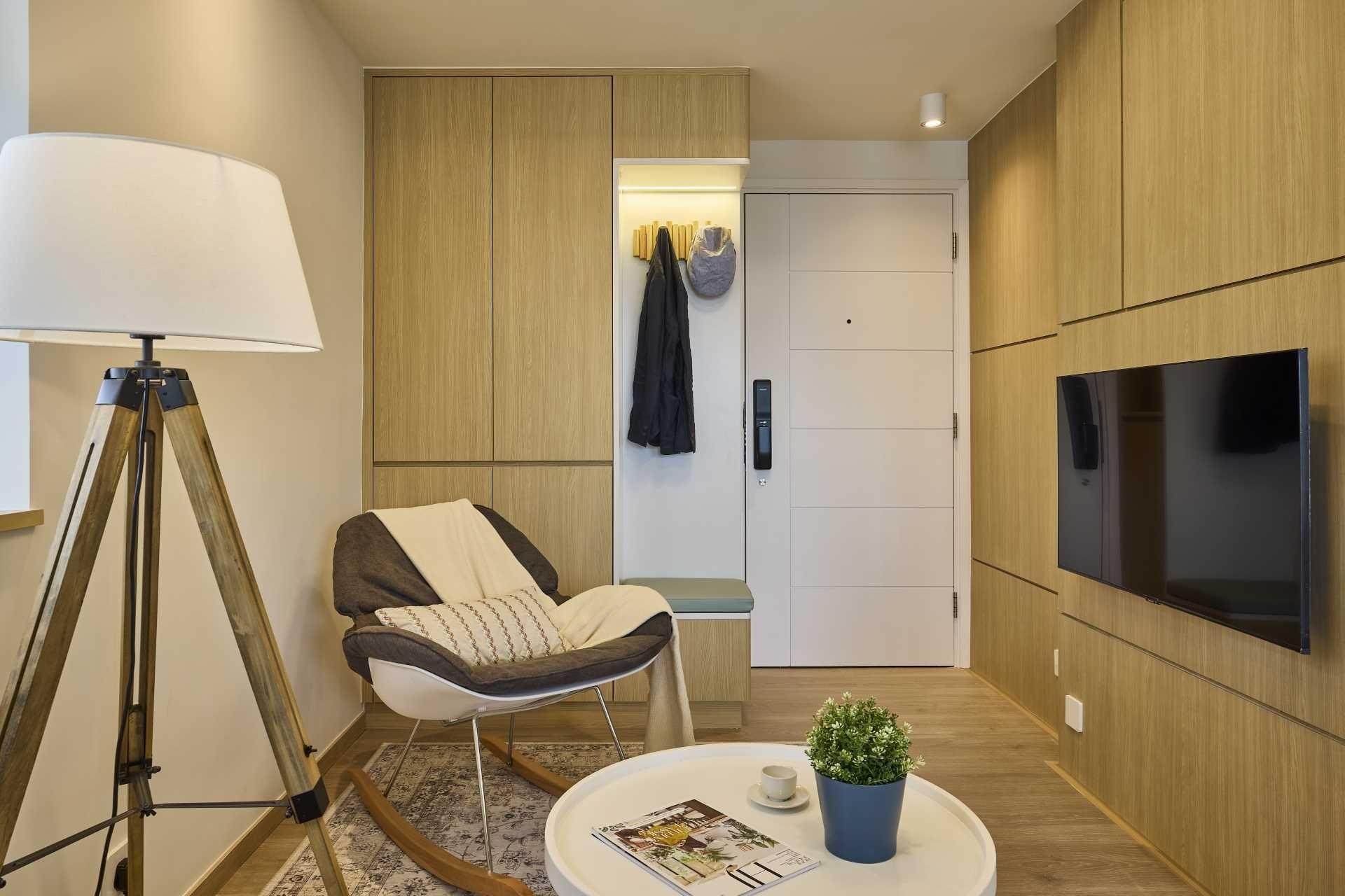 A small entryway packed with smart storage ideas. Built-in cabinets, a bench, and wall hooks show how even the smallest spaces can work harder without feeling crowded.