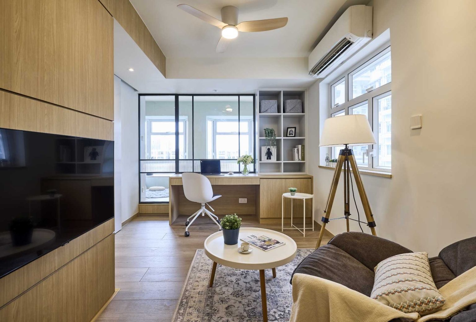 Designed for two people working from home, this open-plan apartment balances flexibility and connection while making a compact footprint feel larger and more inviting.