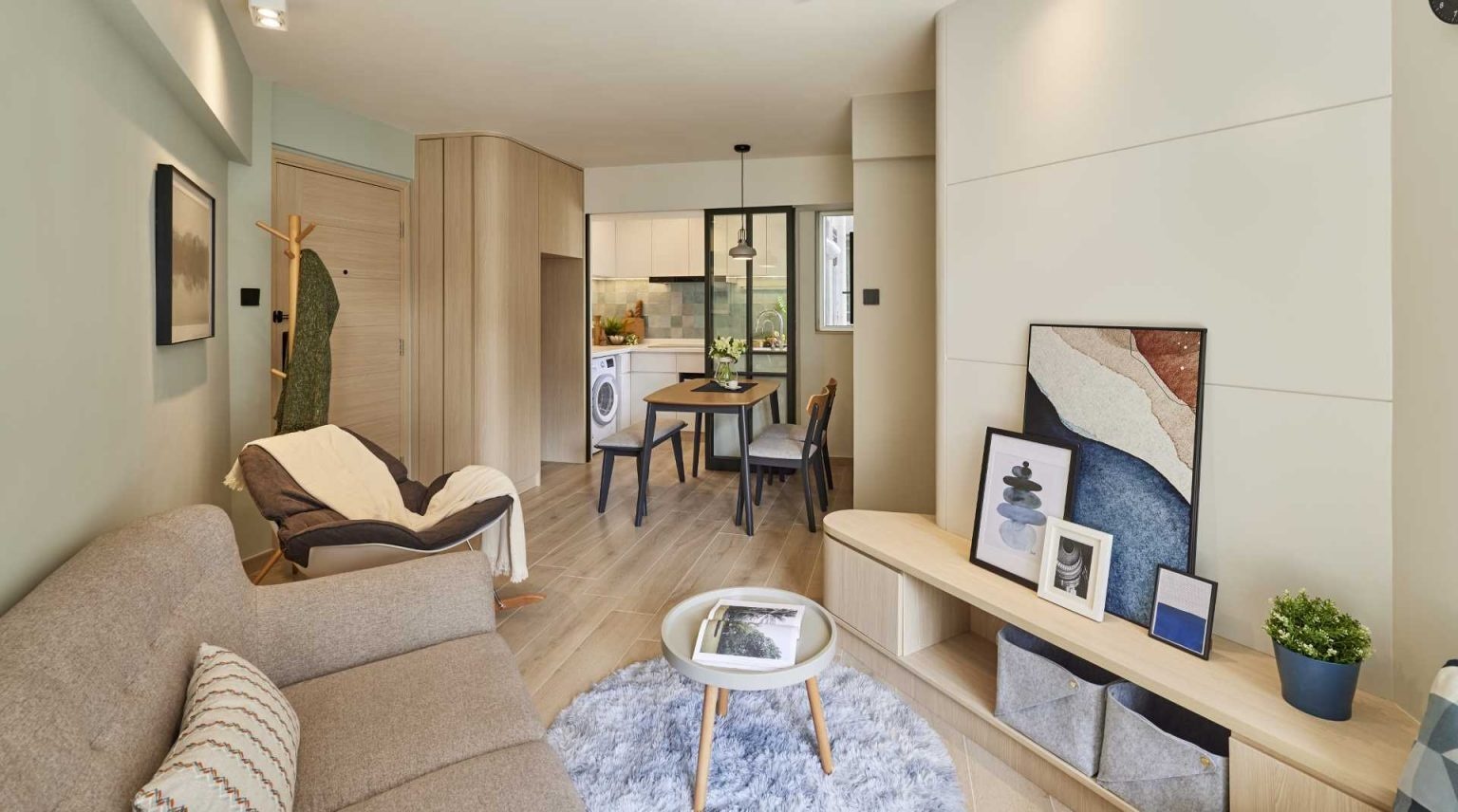 Glass sliding doors keep this small apartment bright while separating the kitchen from the dining area. A smart idea for compact homes.