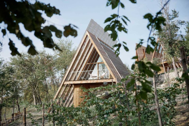 A Collection of A-Frame Cabins Overlooks the Vineyards of Italy