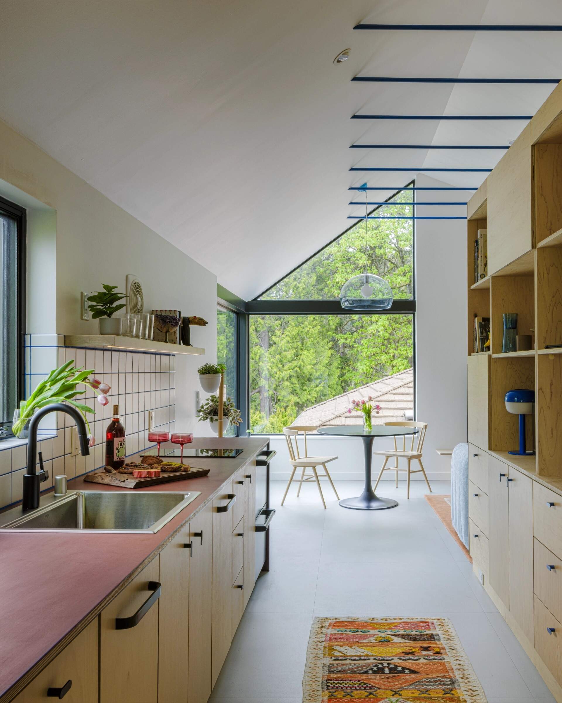A simple galley kitchen proves compact layouts can still provide plenty of storage and an open feel.