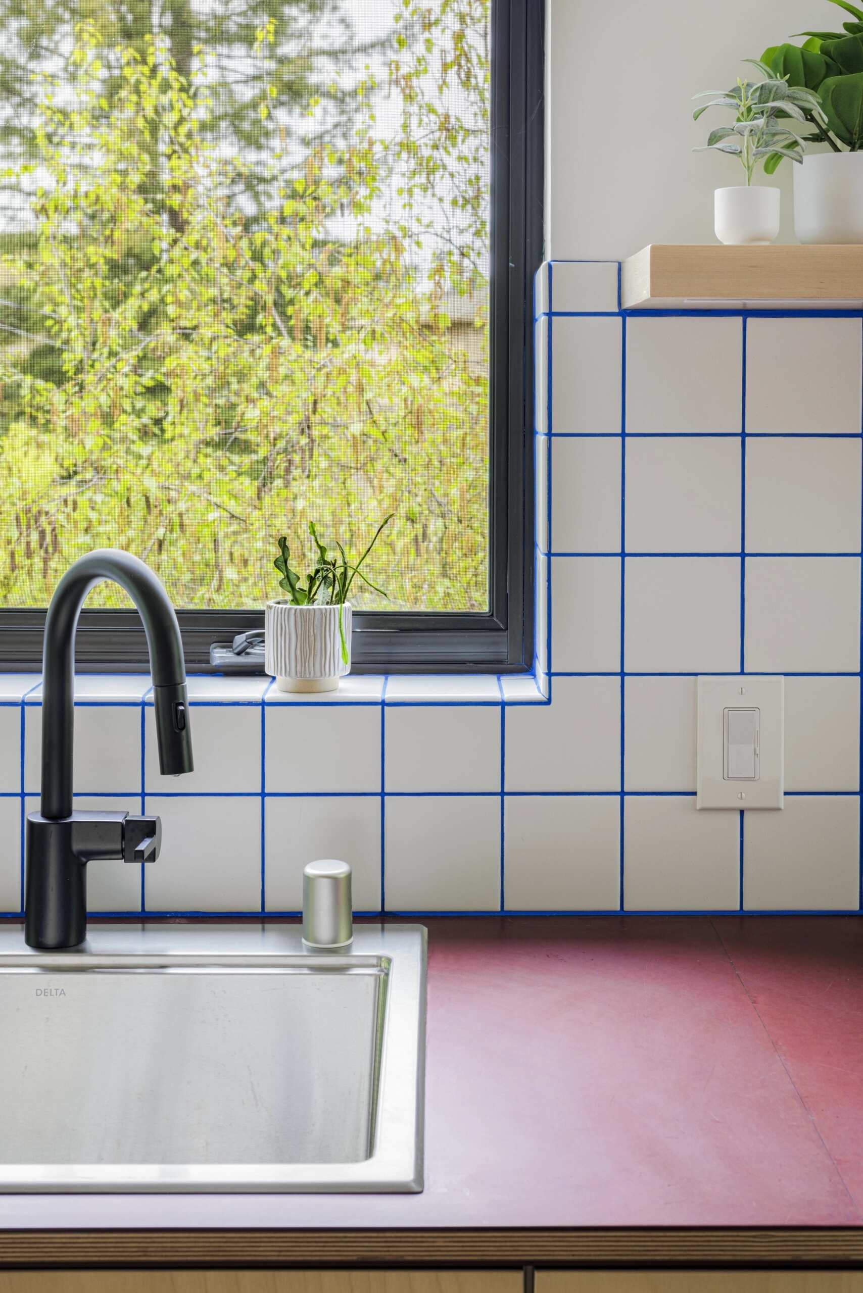 A simple galley kitchen proves compact layouts can still provide plenty of storage and an open feel.