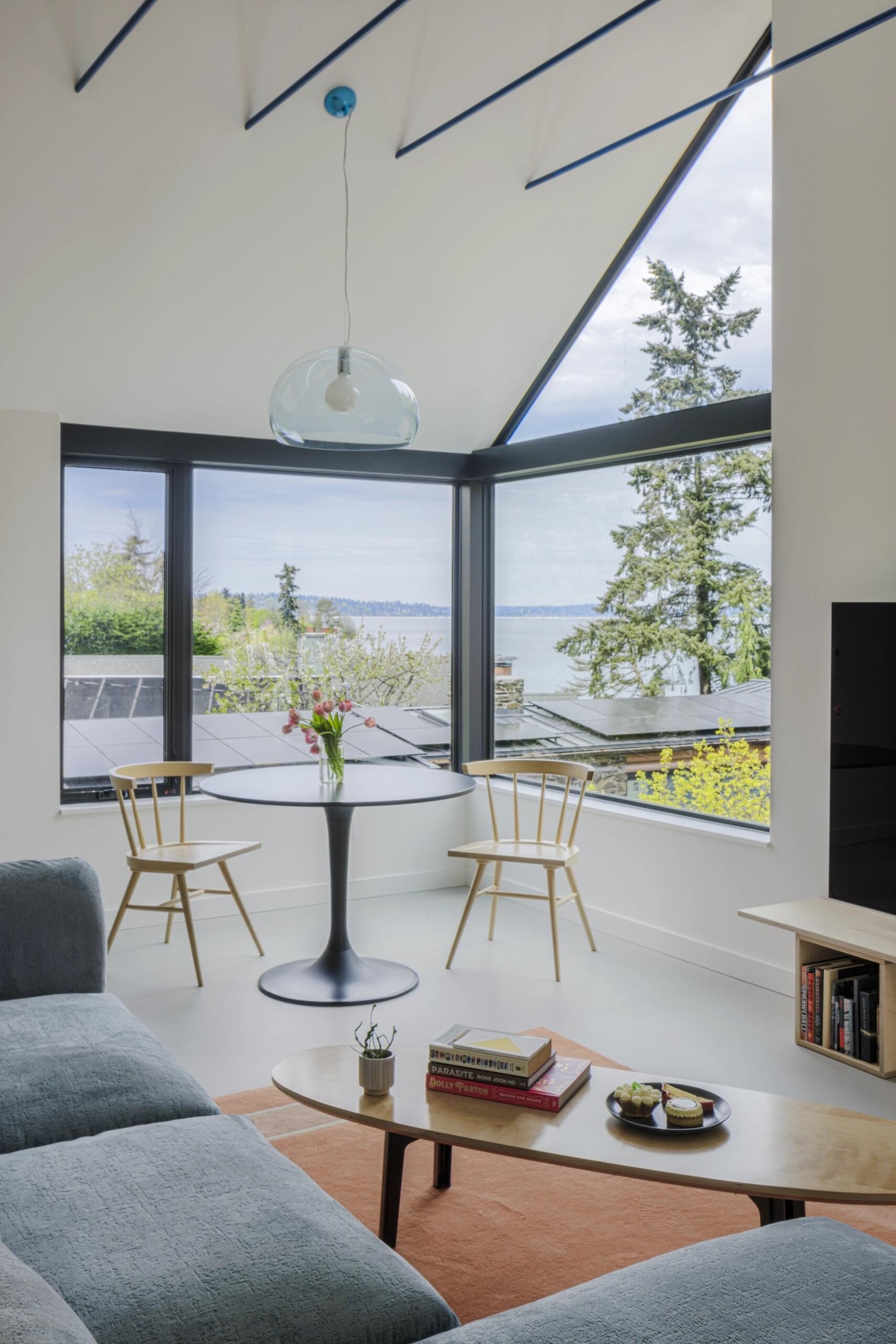 Corner windows turn this compact dining space into one of the brightest spots in the apartment.