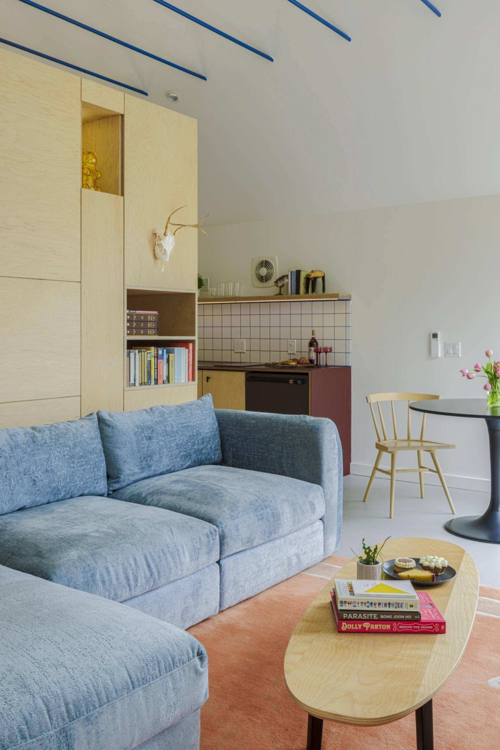 High ceilings and lake views help this small Seattle studio living room feel surprisingly spacious.