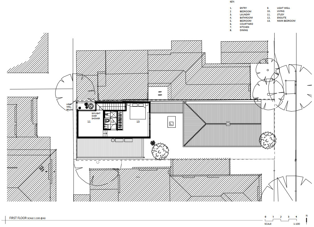 Explore how two separate buildings and a landscaped courtyard create a floor plan that balances heritage architecture with contemporary family living.