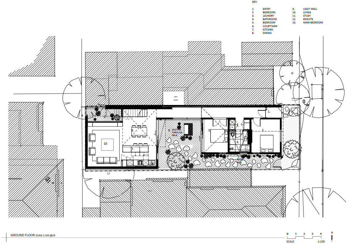 Explore how two separate buildings and a landscaped courtyard create a floor plan that balances heritage architecture with contemporary family living.