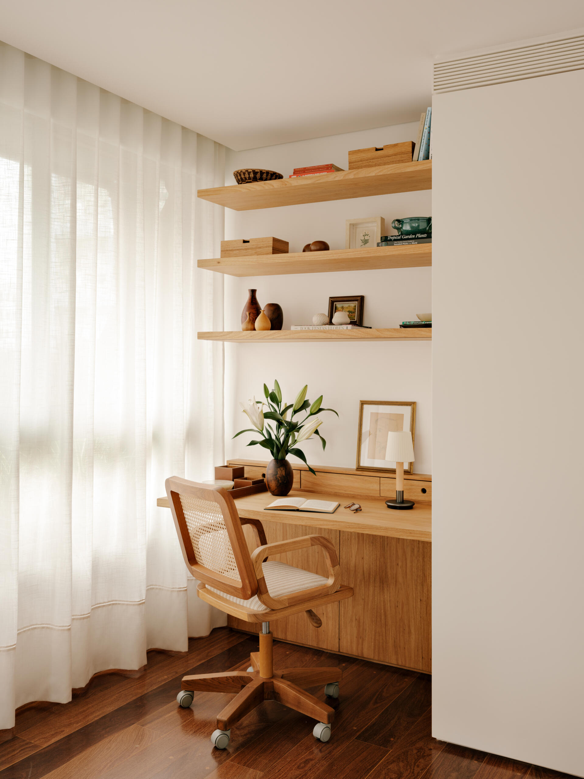 This built-in bedroom office combines floating shelves, timber joinery and smart storage in a beautifully compact layout.