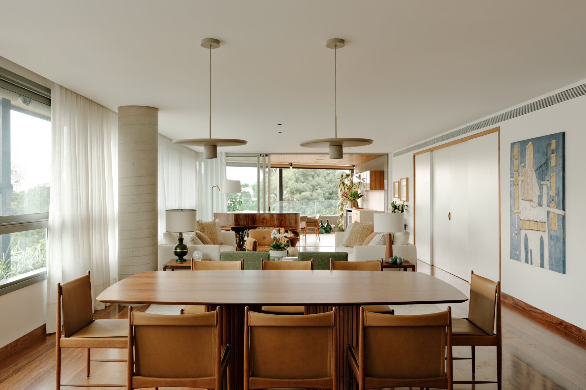 This elegant living room mixes restored furniture, a grand piano and custom interiors to create a welcoming contemporary apartment.