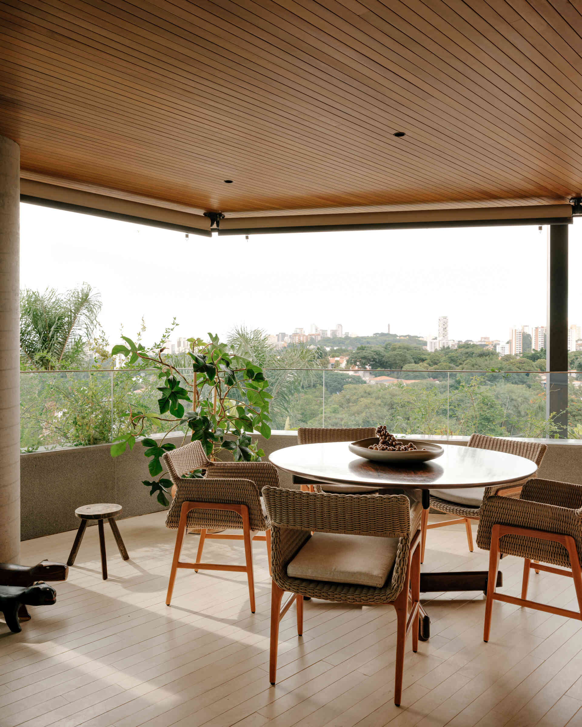 This covered terrace combines a built-in stone bar, timber details and family treasures to create an inviting entertaining space.
