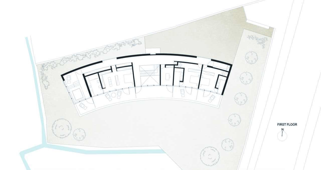 Explore the floor plans behind this remarkable curved house and discover how one continuous form shapes every room, outdoor space, and circulation path.