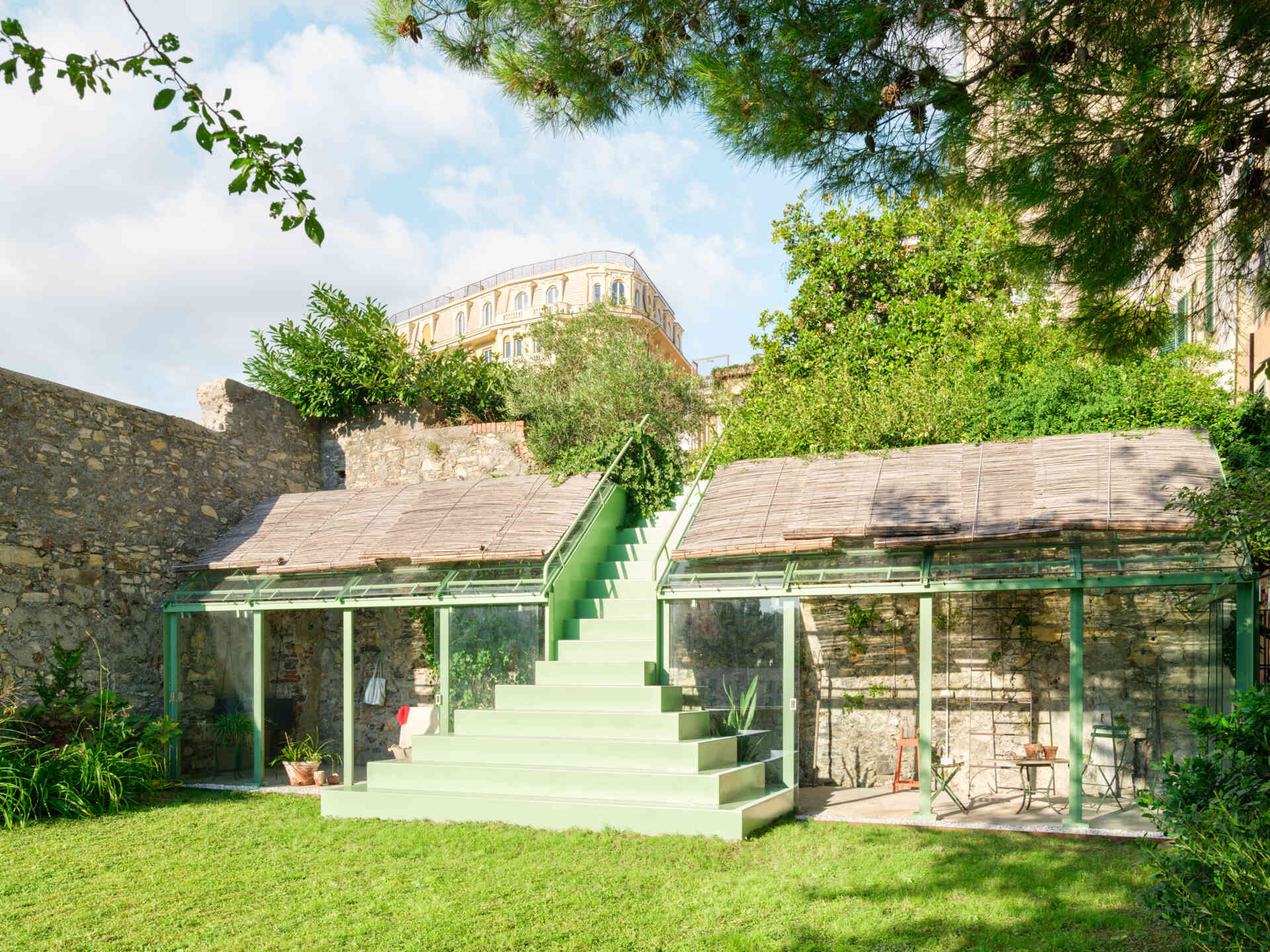 Discover how a simple change in elevation inspired a sculptural staircase and greenhouse that bring fresh architectural character to a private garden in Genoa.