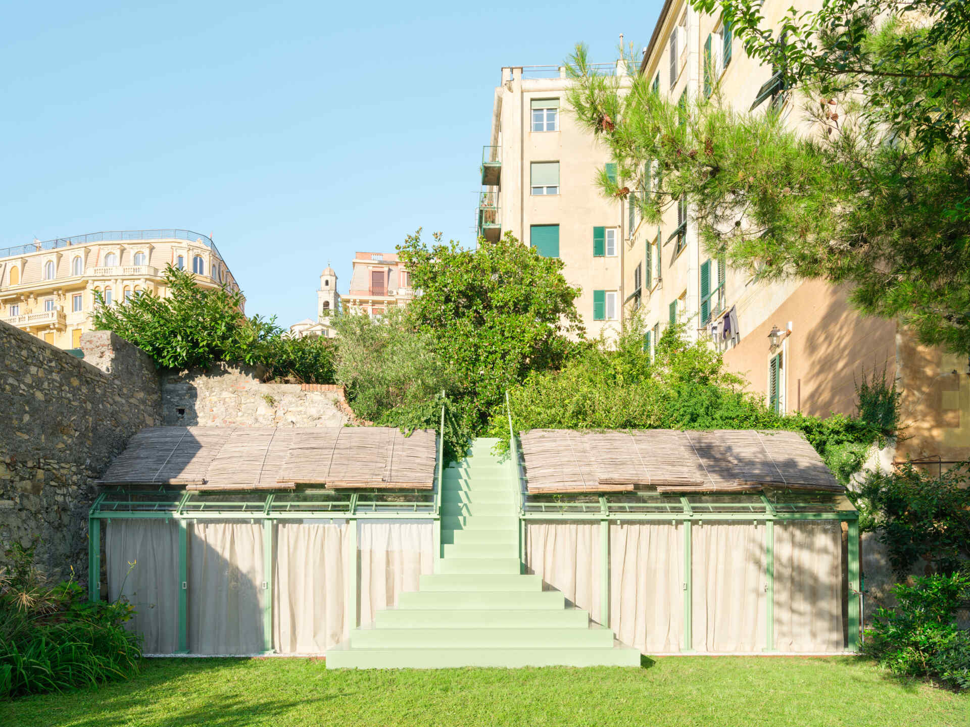 Discover how a simple change in elevation inspired a sculptural staircase and greenhouse that bring fresh architectural character to a private garden in Genoa.