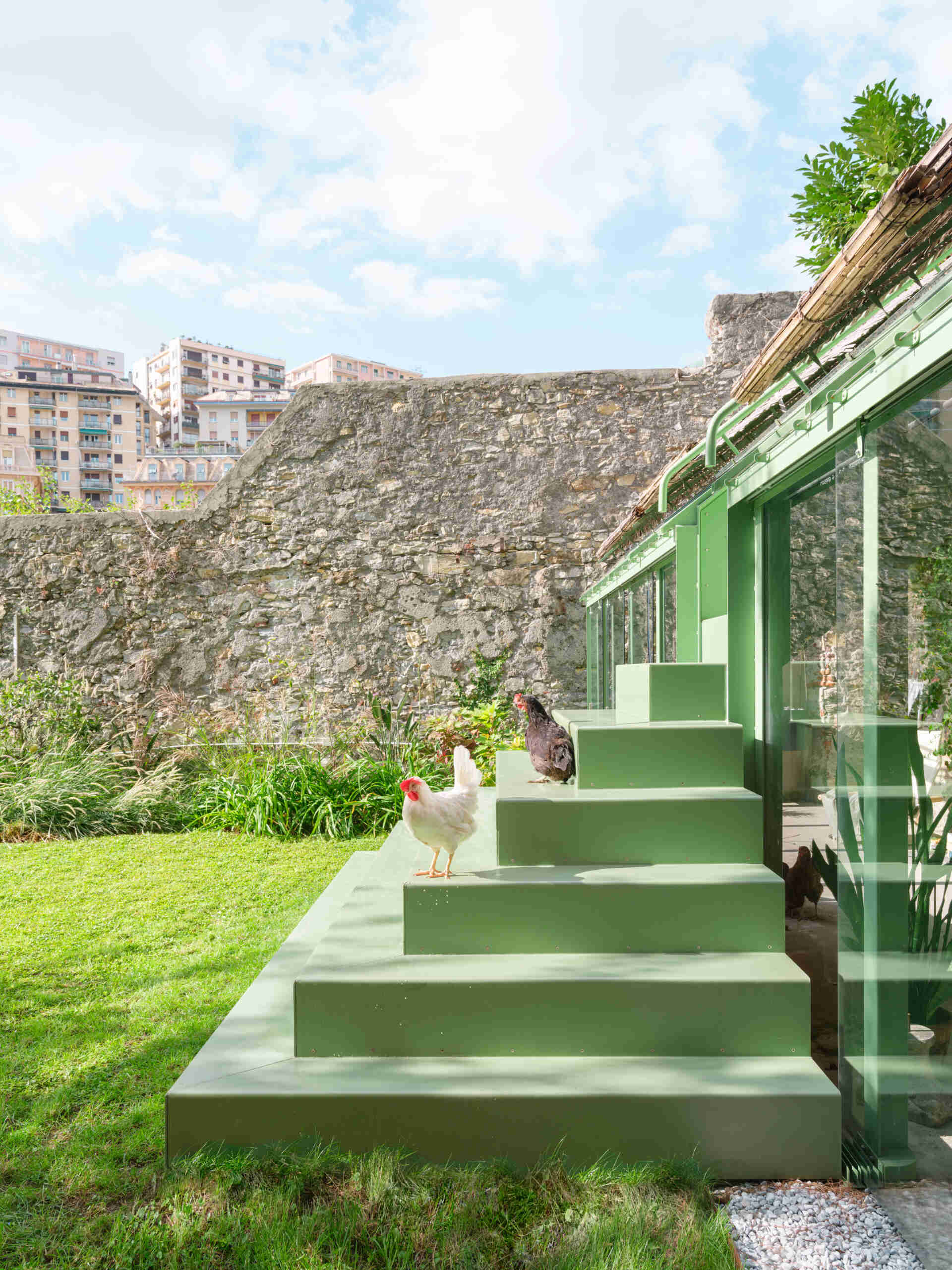 This sculptural powder-coated steel staircase transforms a simple garden path into an architectural feature with beautiful changing views.