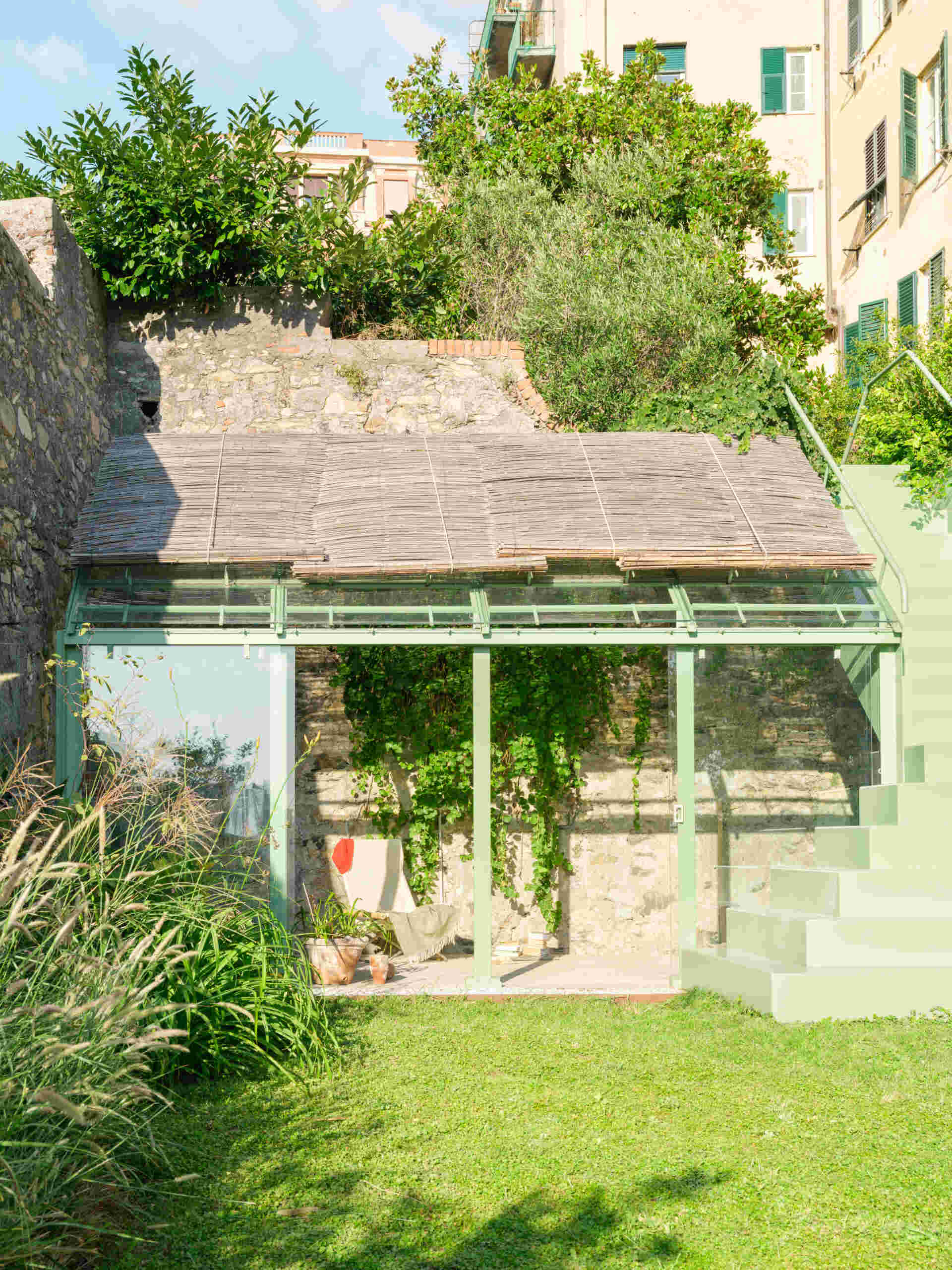 This sculptural powder-coated steel staircase transforms a simple garden path into an architectural feature with beautiful changing views.