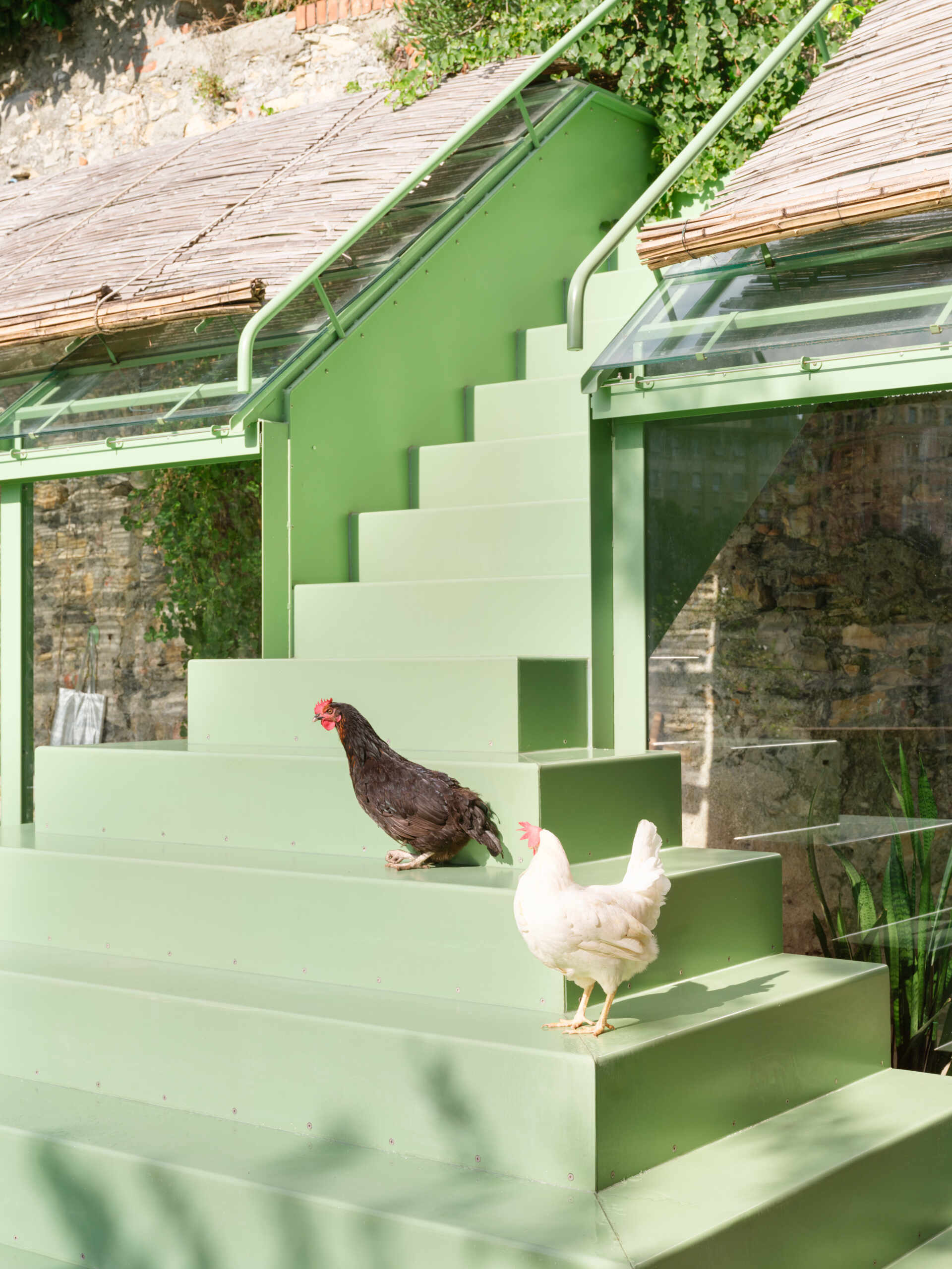 This sculptural powder-coated steel staircase transforms a simple garden path into an architectural feature with beautiful changing views.