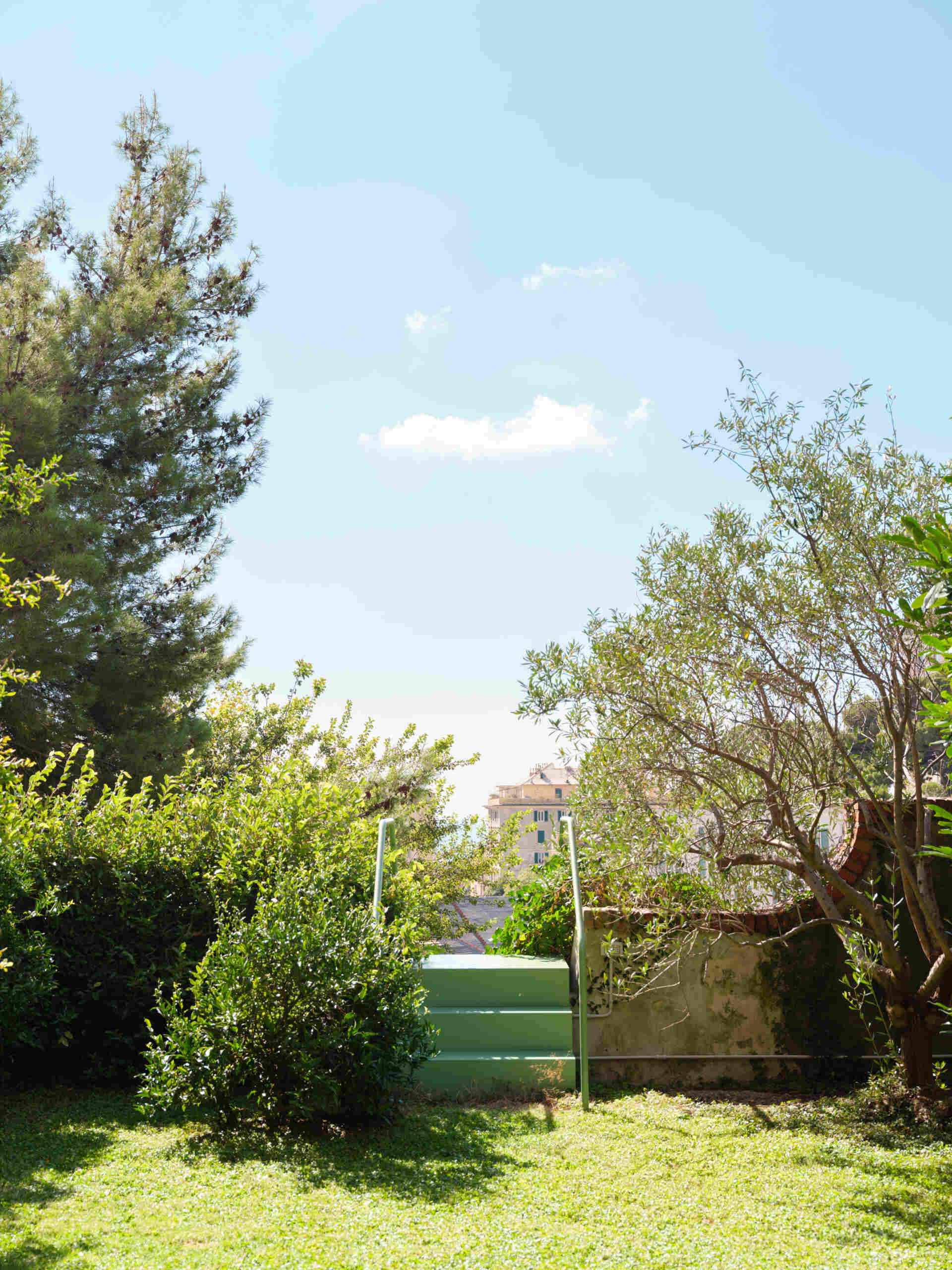 This sculptural powder-coated steel staircase transforms a simple garden path into an architectural feature with beautiful changing views.