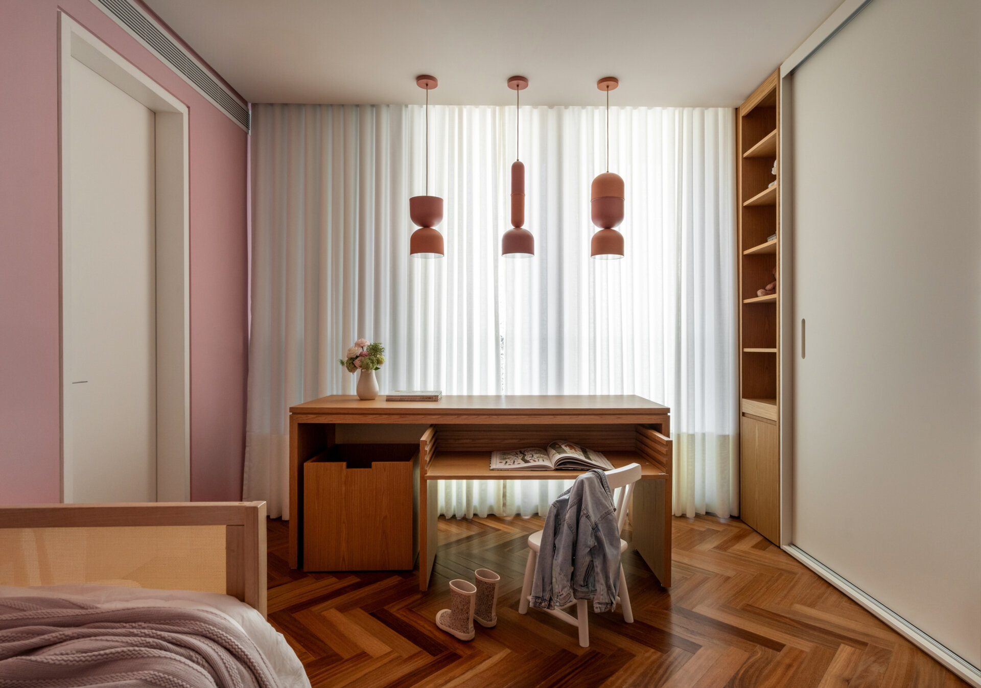 Adjustable beds and custom desks allow these children's bedrooms to grow alongside their young occupants.