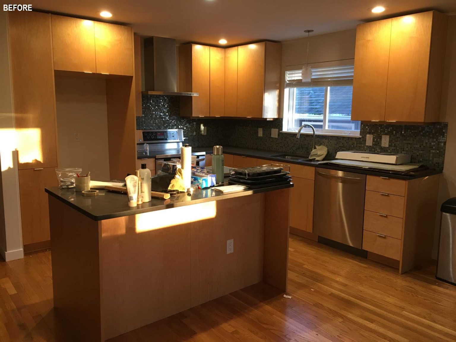 From a dark enclosed kitchen to a bright modern space with ceiling-height cabinetry, wood finishes, and floor-to-ceiling glazing, this renovation is full of inspiration.