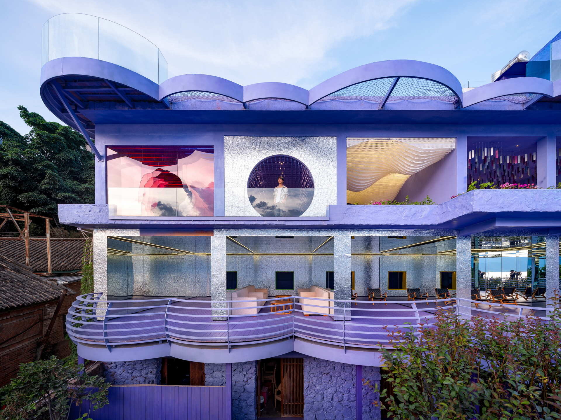 Cloud-inspired violet forms, colorful terraces and surreal design ideas come together at Manwu Jimu Guesthouse, where architecture and landscape create an unforgettable experience.