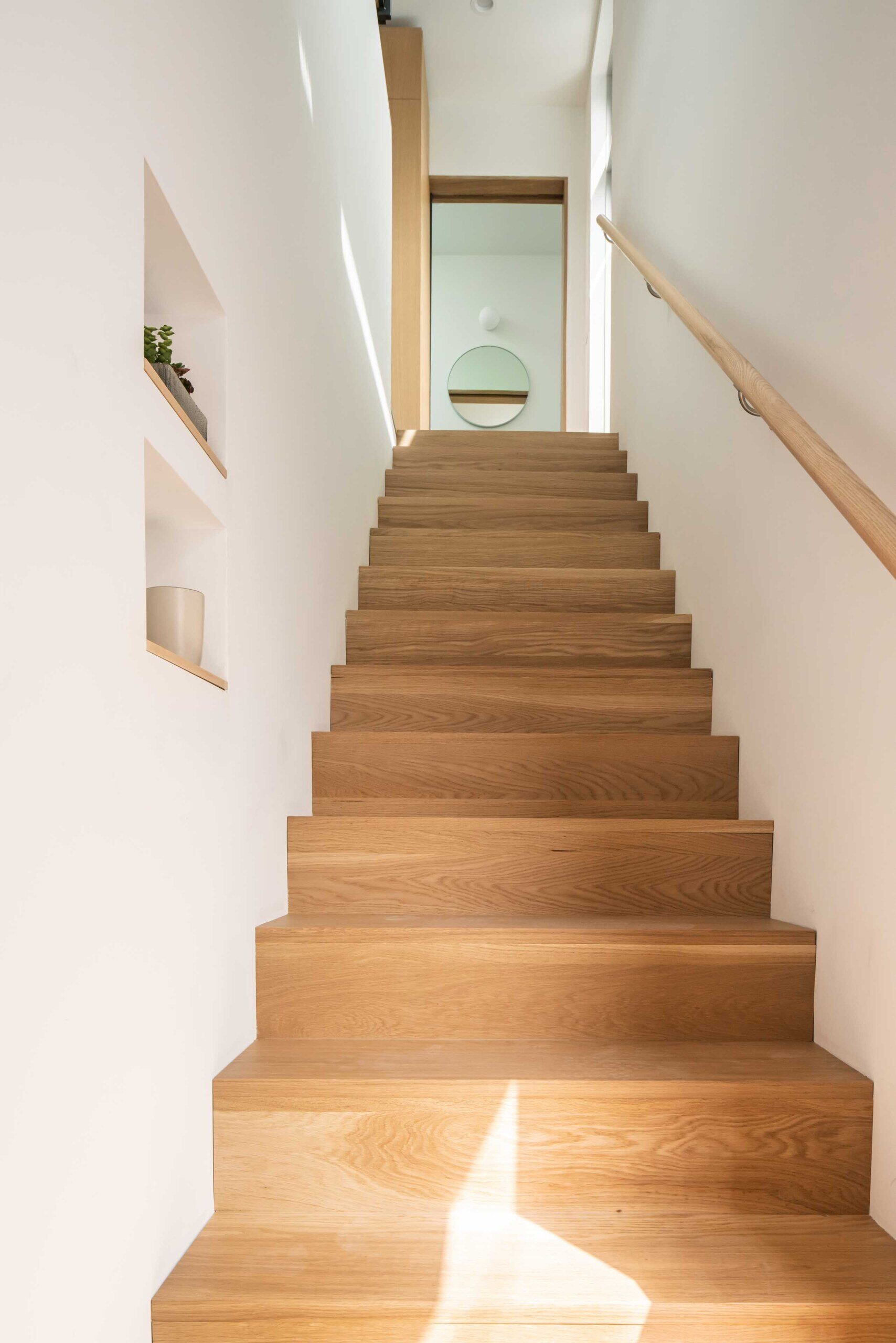 Discover how a private stairway and smart window placement make this backyard ADU feel completely independent.