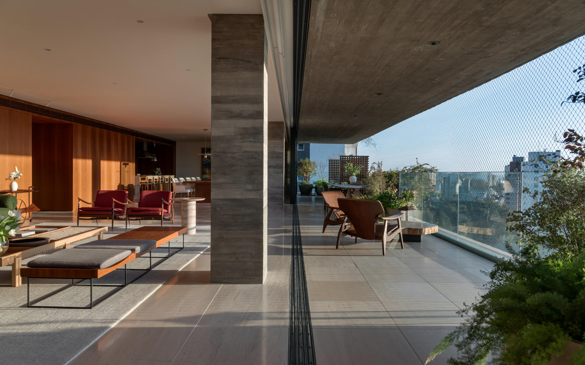 Matching limestone floors blur the line between the living room and terrace, creating one expansive entertaining space.