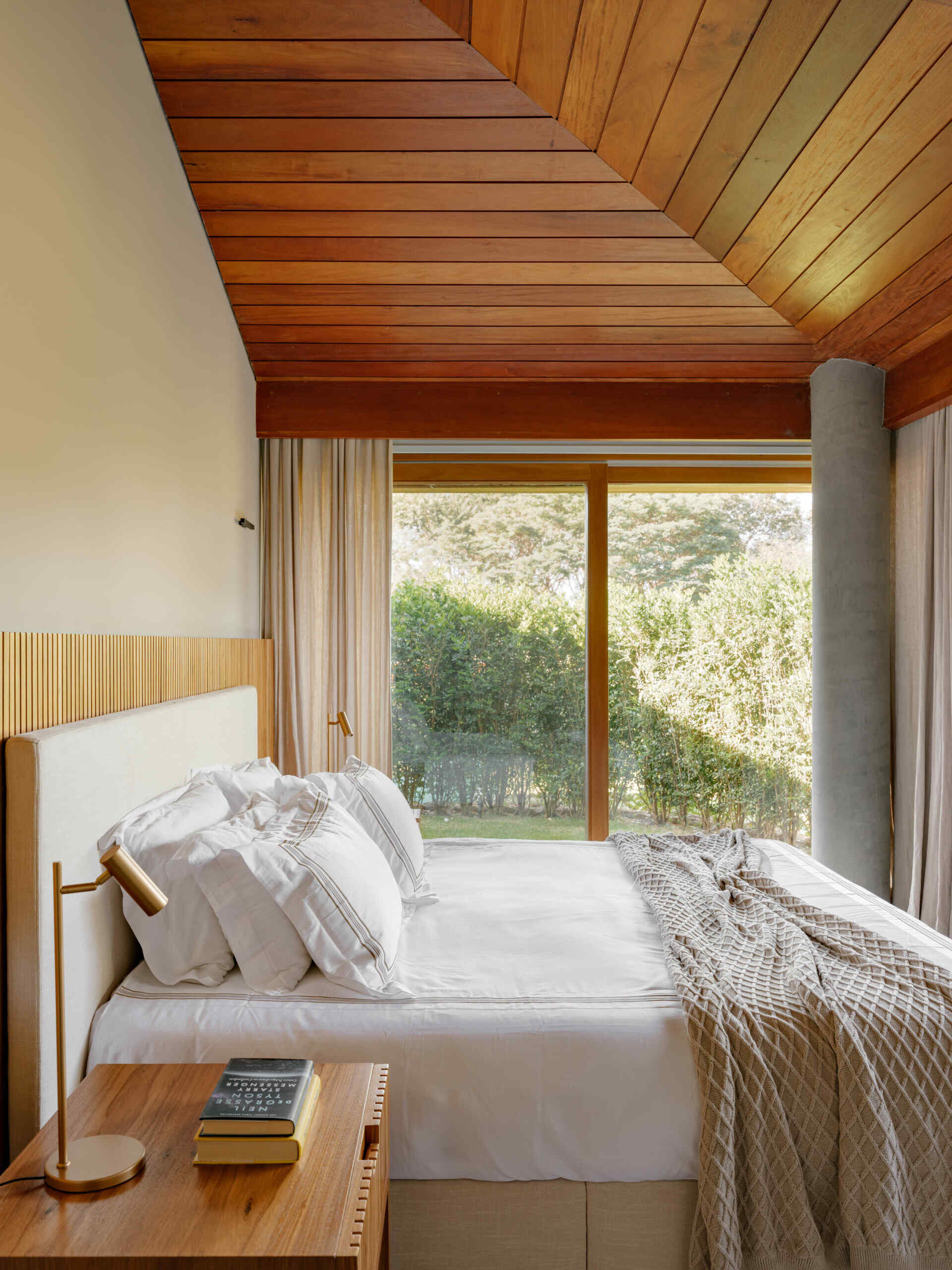 The home's bedroom suites continue the neutral color palette found throughout the residence. Timber finishes, soft materials and natural light create comfortable spaces that feel consistent with the rest of the interior.