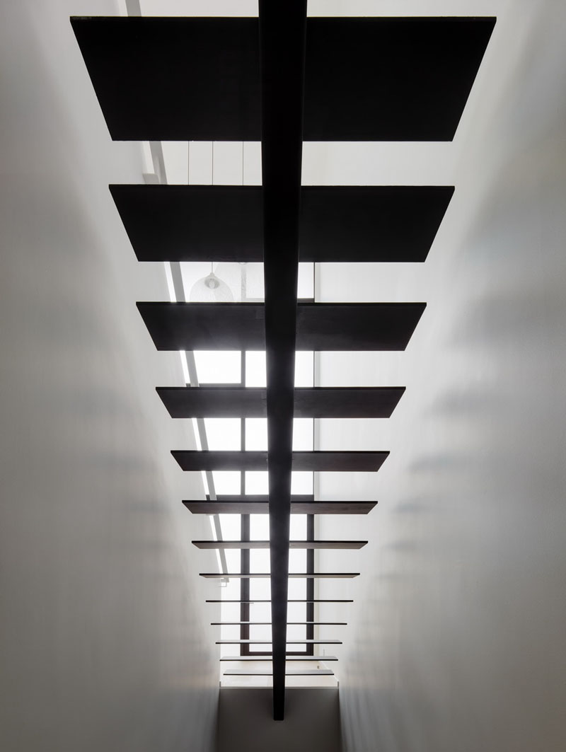 Looking beneath the stairs reveals another example of the home's clean detailing, where every element has been simplified to match the overall aesthetic.