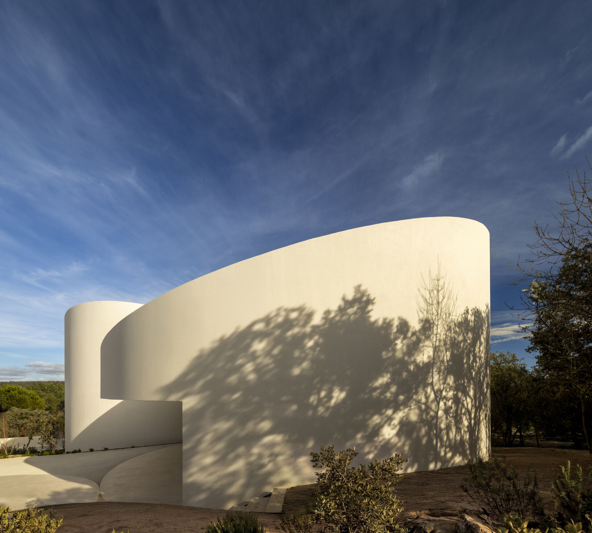 Explore how five curved volumes and an unusual floor plan combine to create one of Madrid's most distinctive contemporary homes.