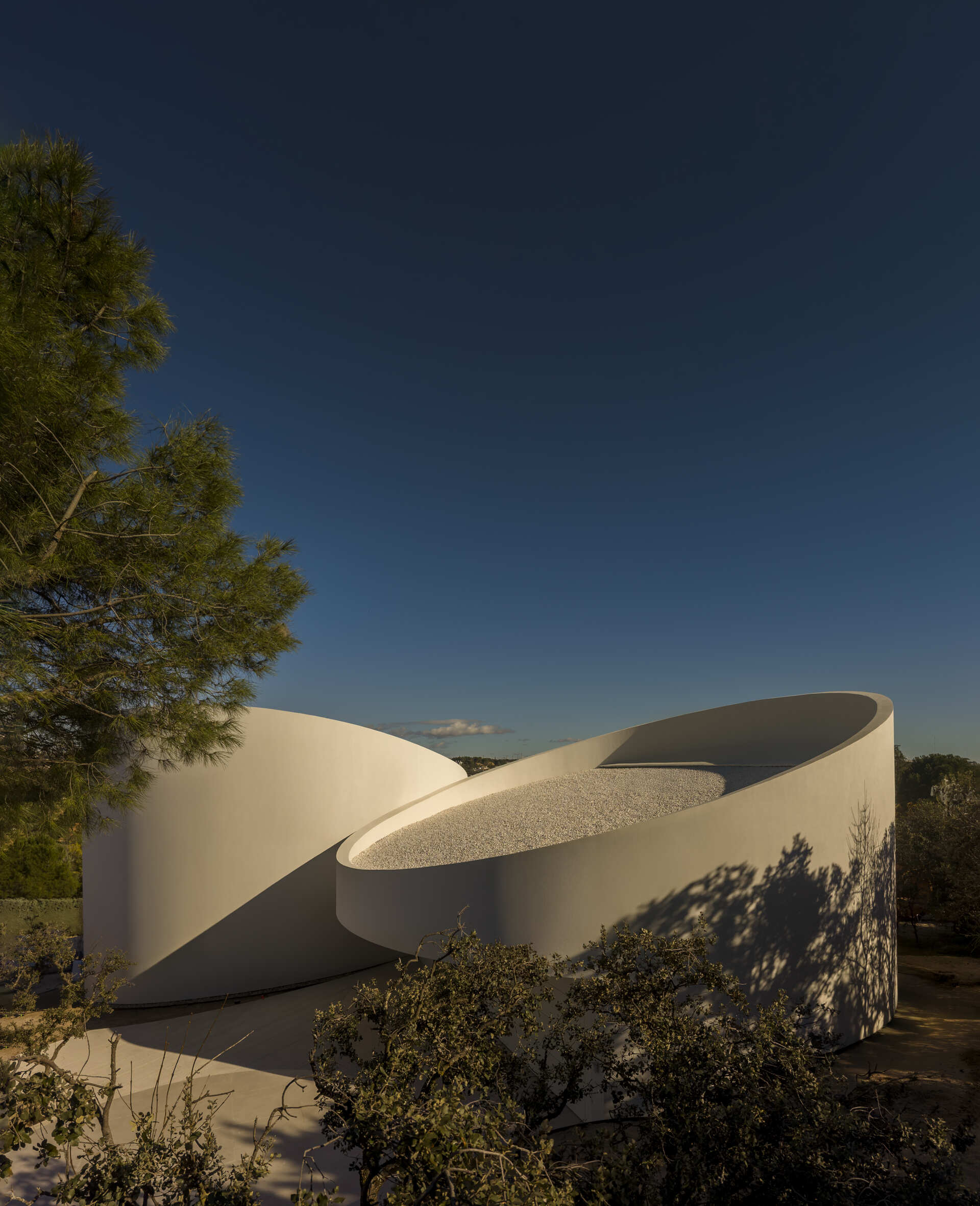 Explore how five curved volumes and an unusual floor plan combine to create one of Madrid's most distinctive contemporary homes.