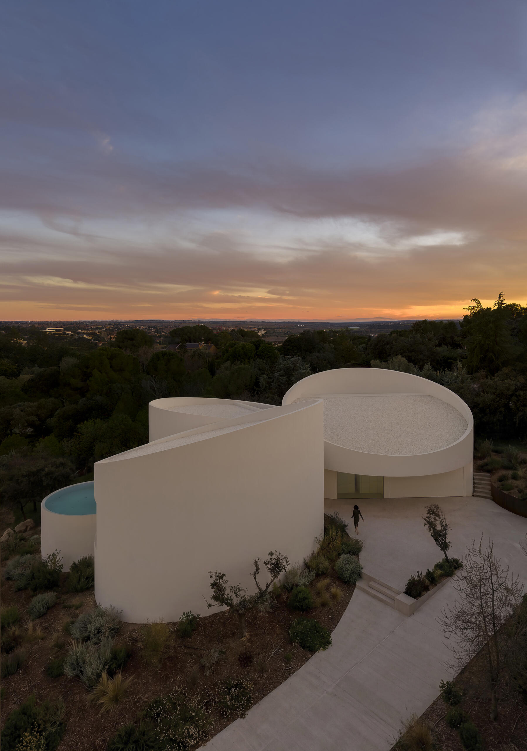 Explore how five curved volumes and an unusual floor plan combine to create one of Madrid's most distinctive contemporary homes.