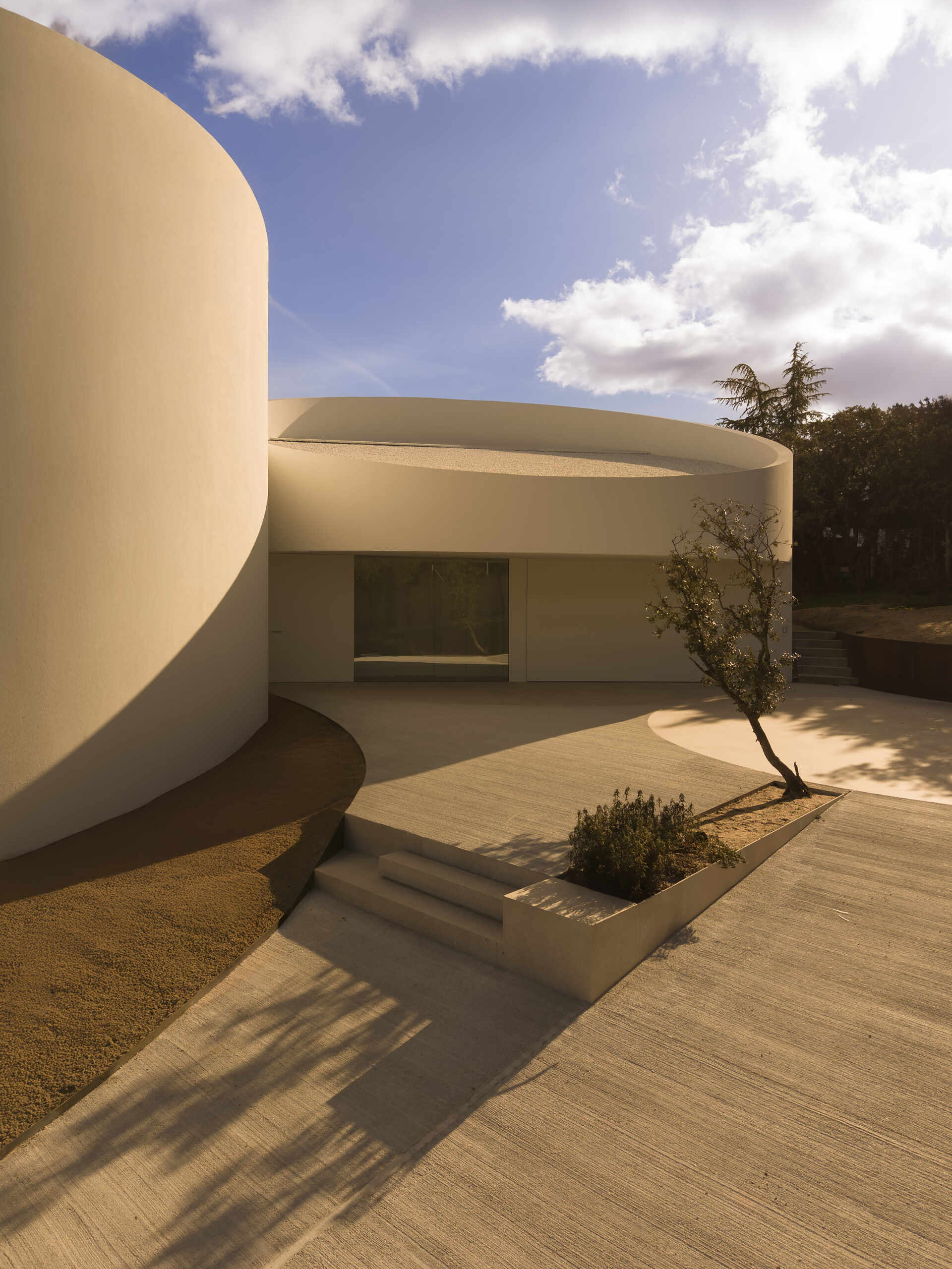 Step inside a modern Madrid home where the entrance is designed as its own sculptural architectural feature.