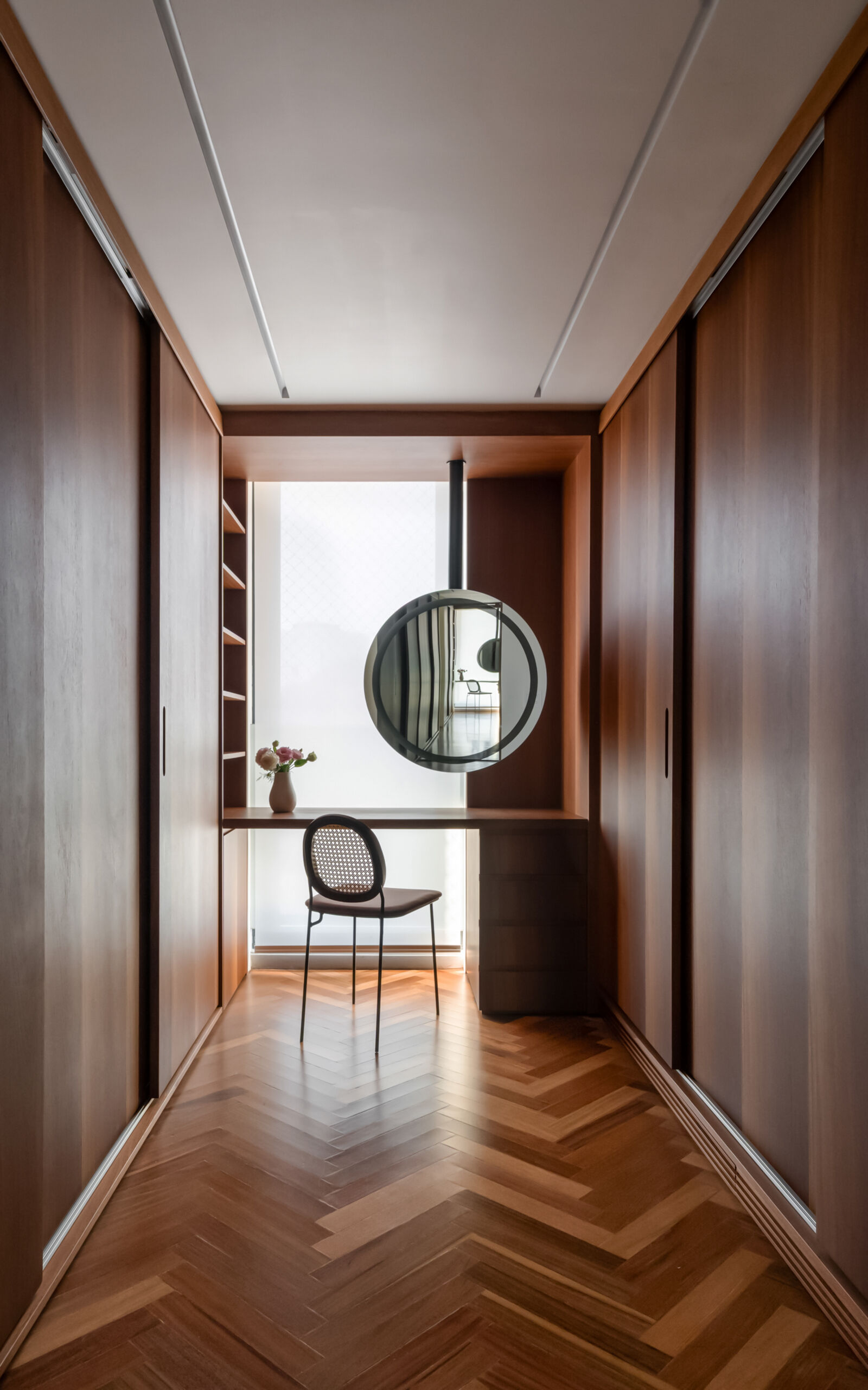 Twin walk-in closets and stone bathrooms create a spacious, organised primary suite with timeless finishes.
