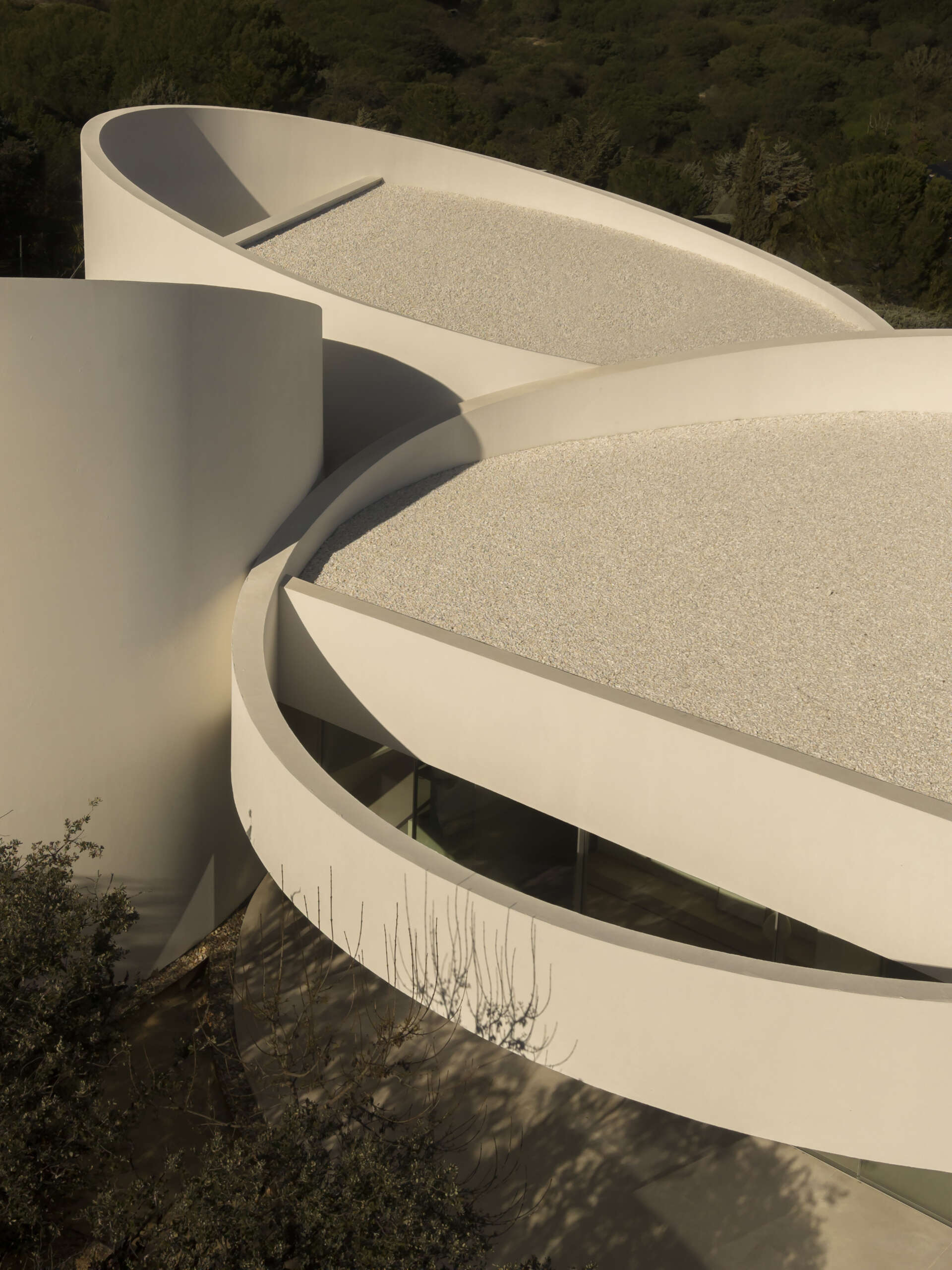 Explore how five curved volumes and an unusual floor plan combine to create one of Madrid's most distinctive contemporary homes.