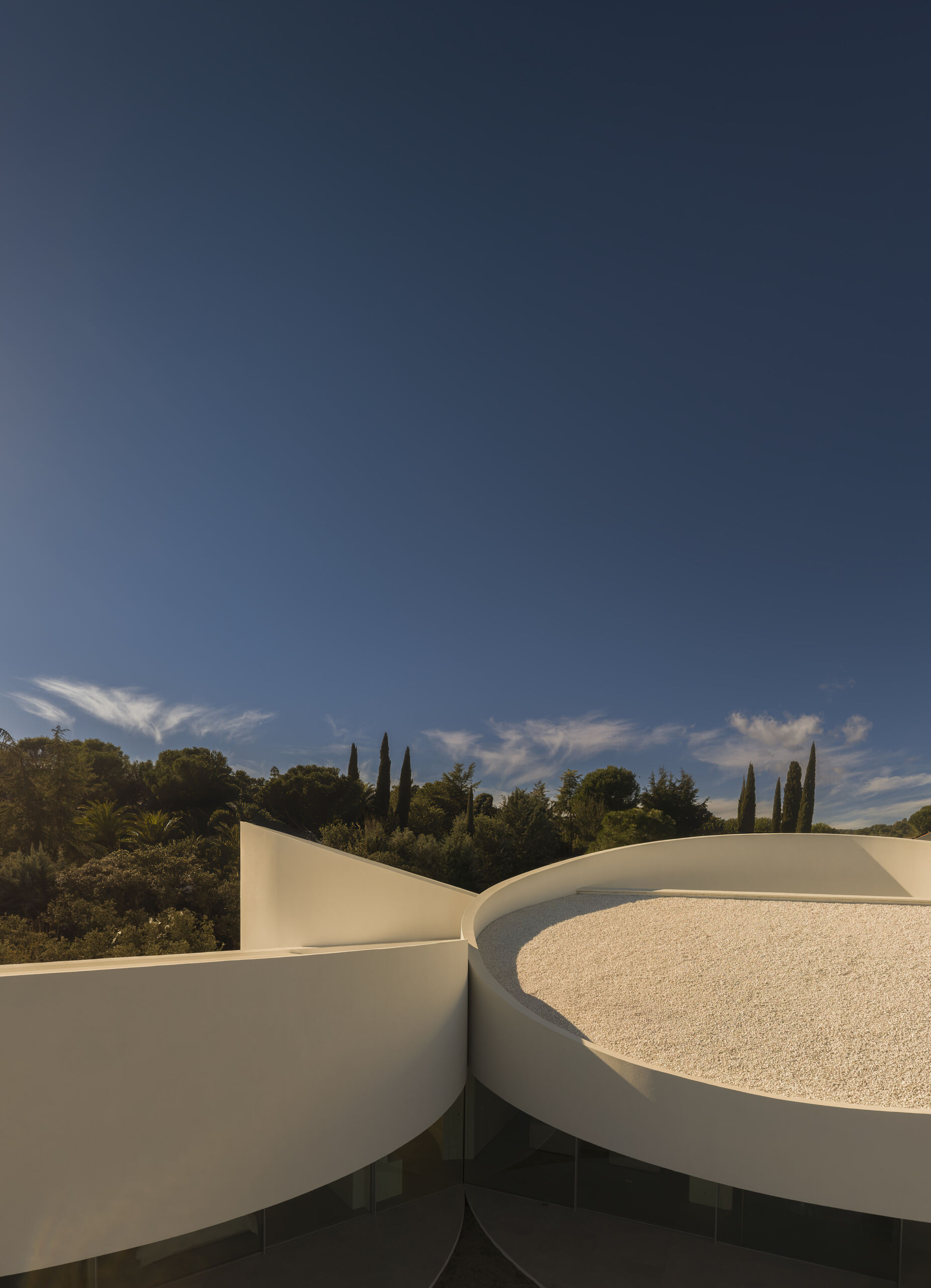 Explore how five curved volumes and an unusual floor plan combine to create one of Madrid's most distinctive contemporary homes.