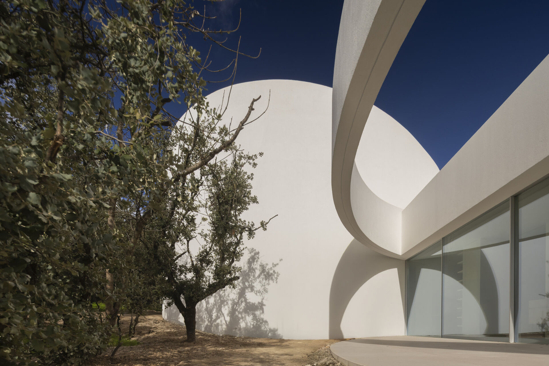 Explore how five curved volumes and an unusual floor plan combine to create one of Madrid's most distinctive contemporary homes.