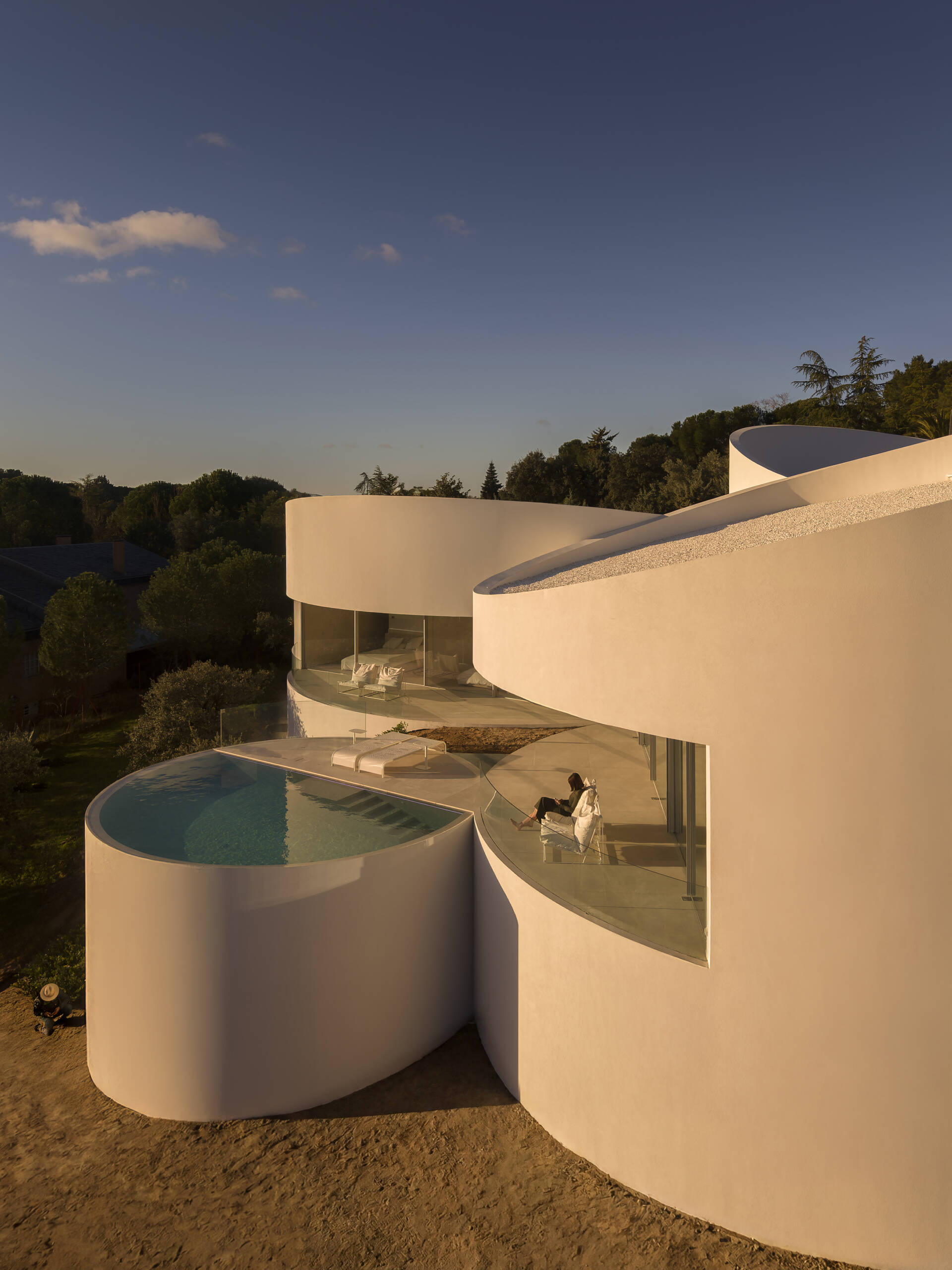 Explore how five curved volumes and an unusual floor plan combine to create one of Madrid's most distinctive contemporary homes.