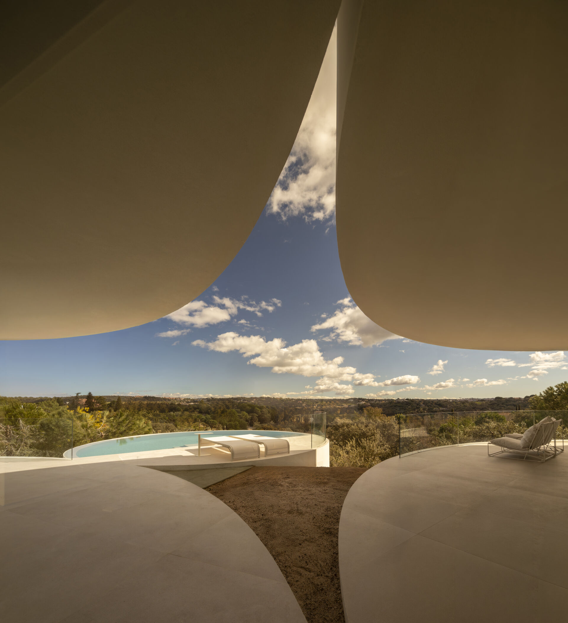 Explore how five curved volumes and an unusual floor plan combine to create one of Madrid's most distinctive contemporary homes.
