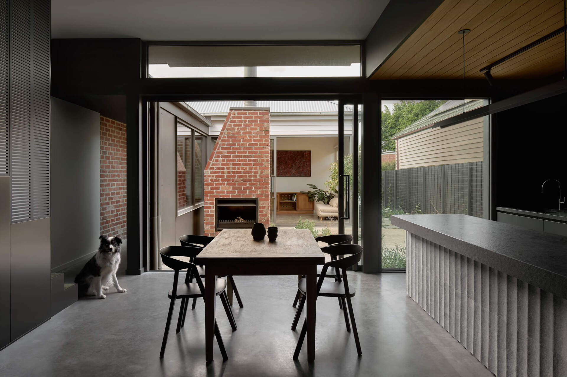 Natural light and a central garden courtyard make this dining space one of the brightest features of the home.