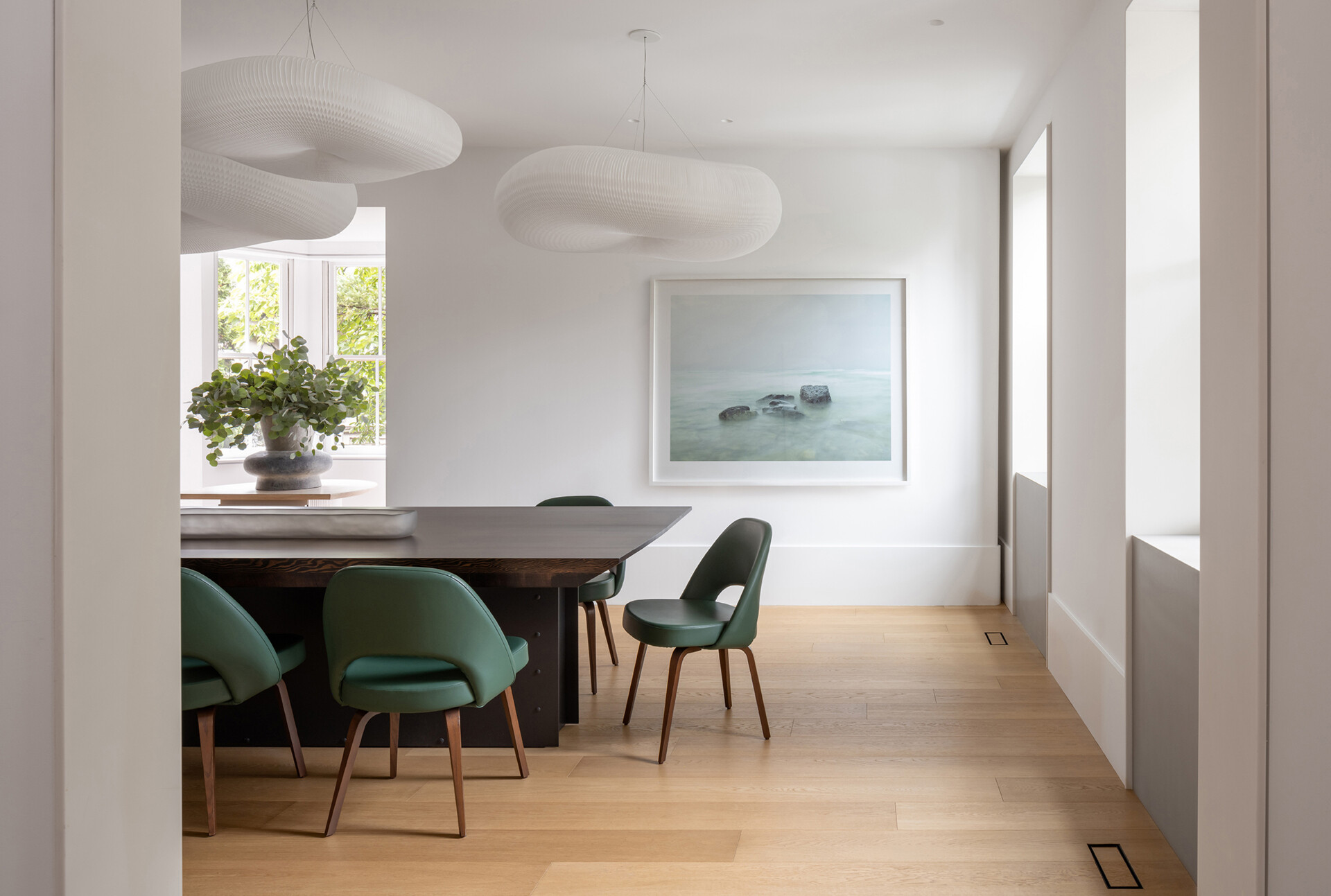 Tour the enlarged dining room at Snider House, where historic architecture is paired with curved furniture and a smoked-mirror coffee bar.