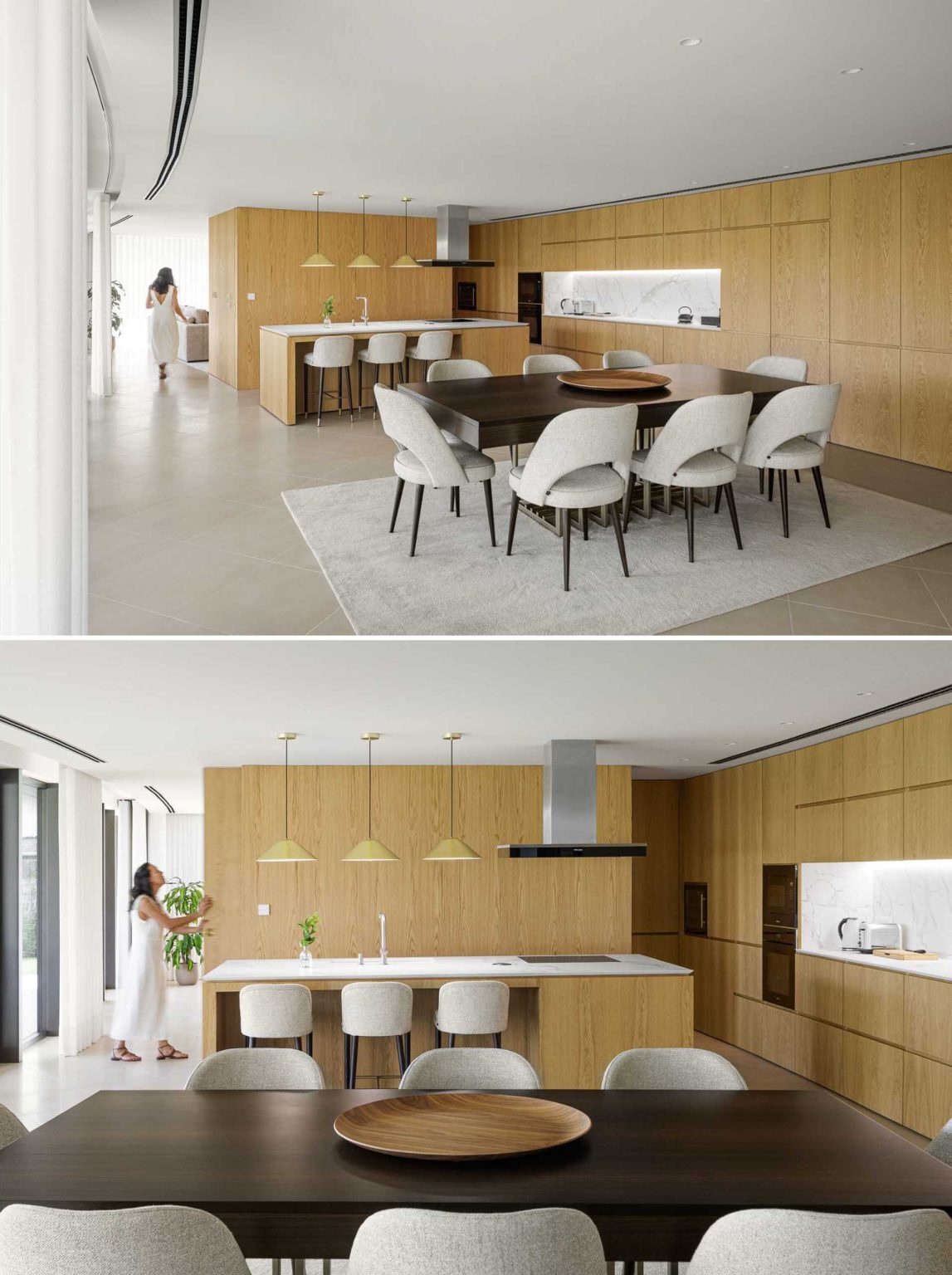 Warm wood cabinetry, polished concrete floors, and a flowing curved wall create a modern open-plan living space full of texture and natural light.