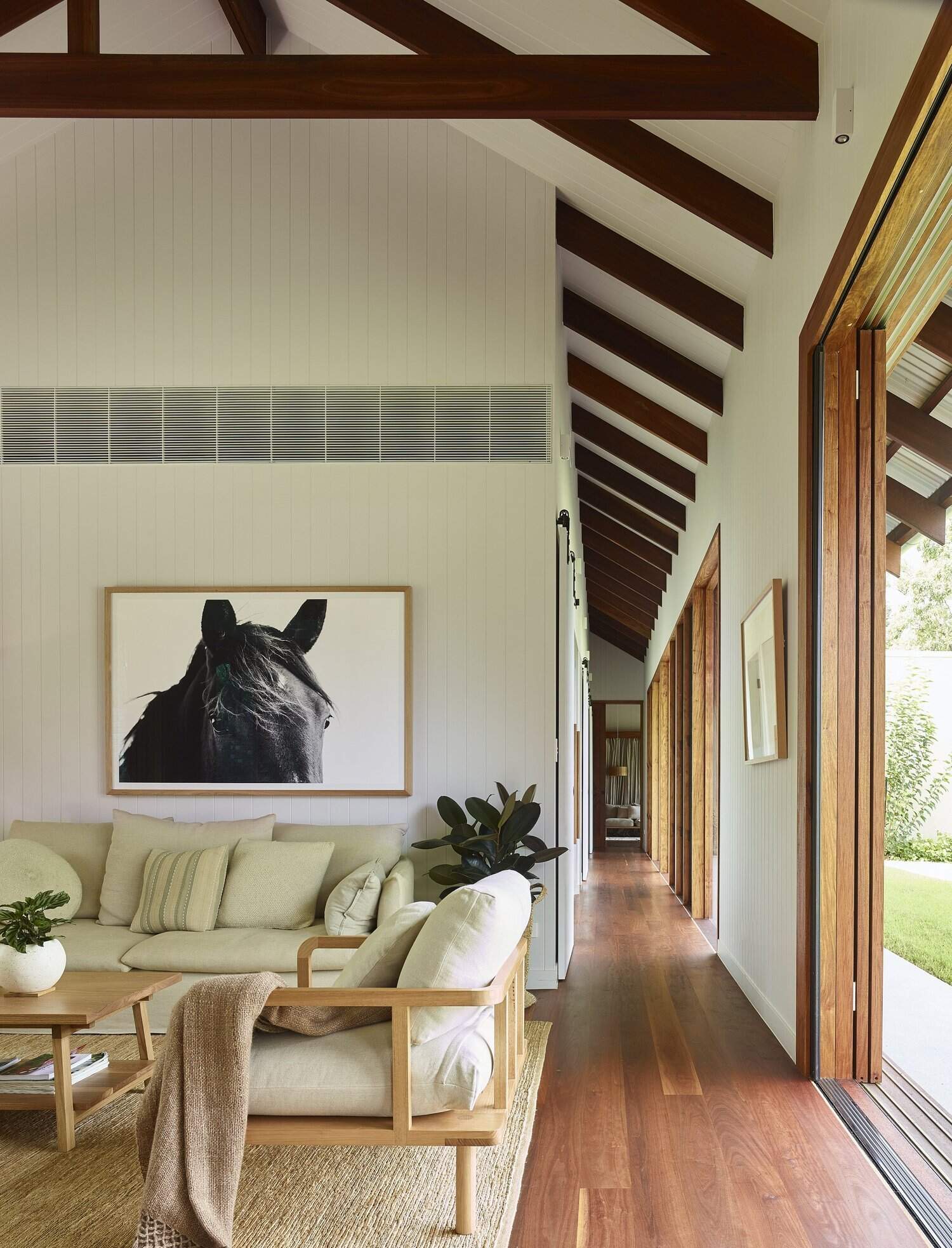 Louver windows and sliding doors help this Brisbane family home stay naturally cool while filling every room with fresh air and light.