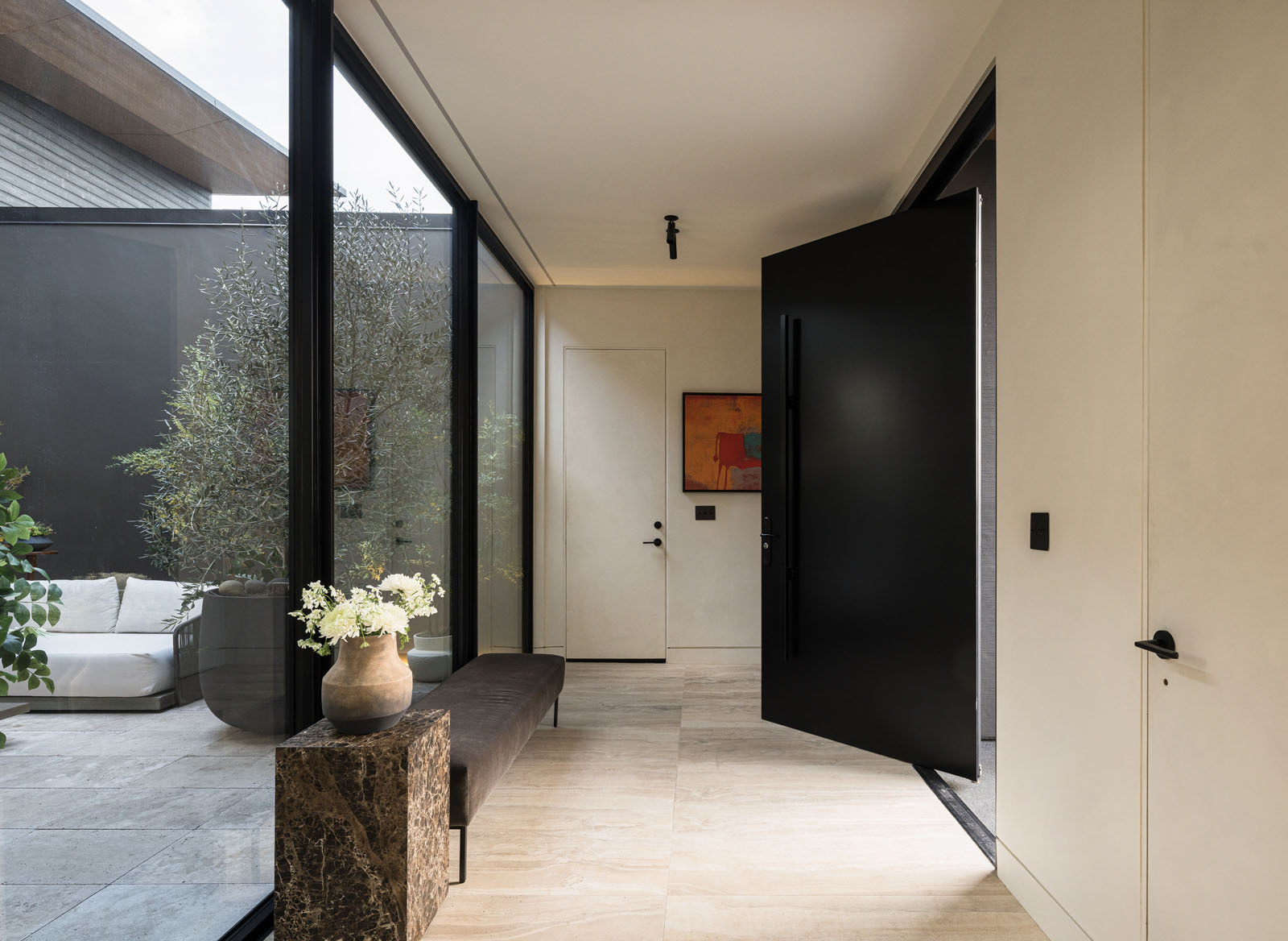 See how Mahya Salehi Studio used a central courtyard and butterfly roof to make this compact Silicon Valley home feel open, bright, and inviting.