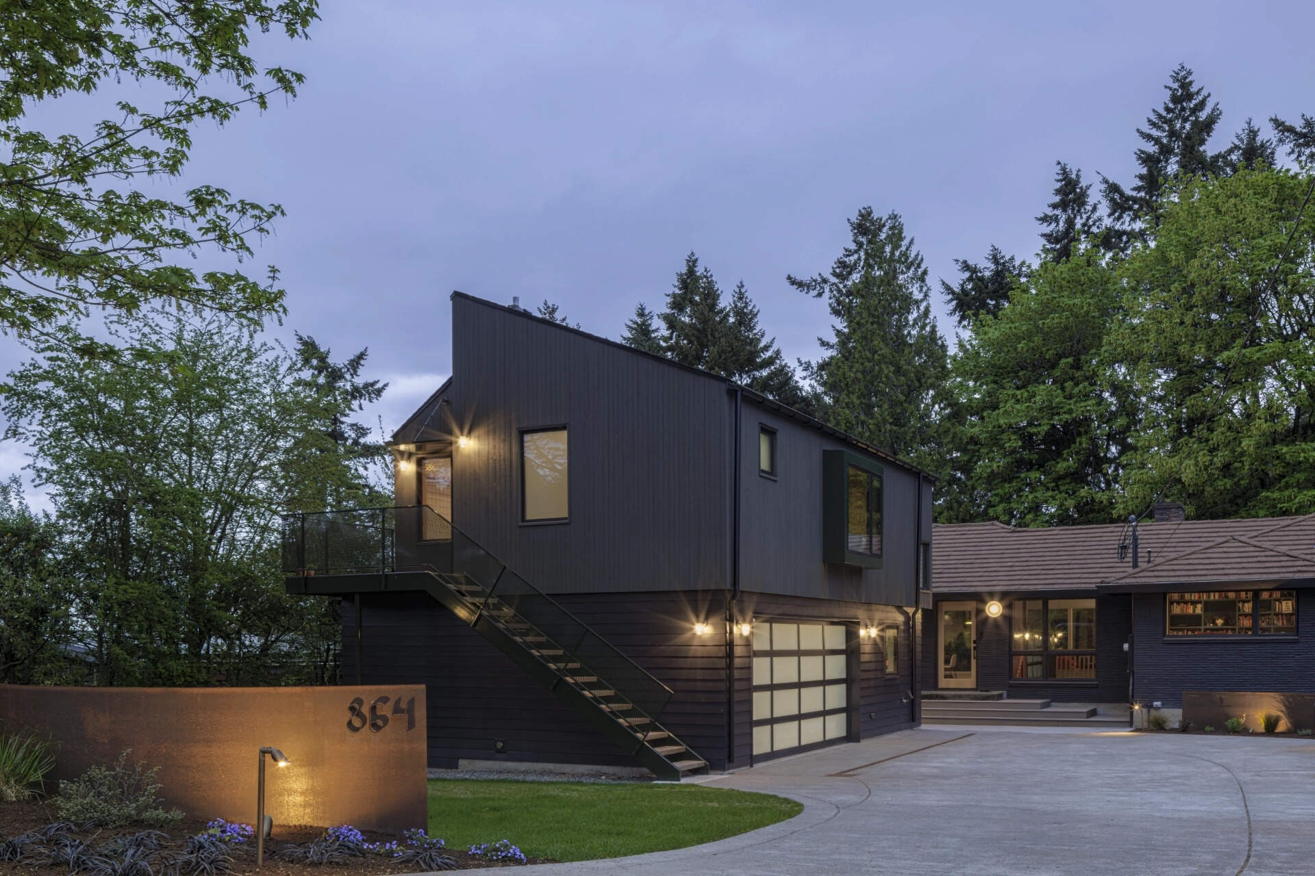 This Seattle garage replacement pairs smart planning with soaring interiors, lake views, and a roof designed with future solar panels in mind.