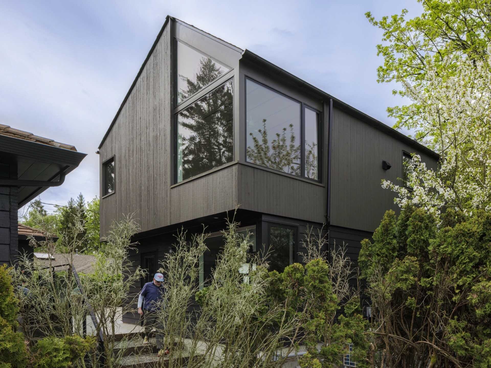 This Seattle garage replacement pairs smart planning with soaring interiors, lake views, and a roof designed with future solar panels in mind.