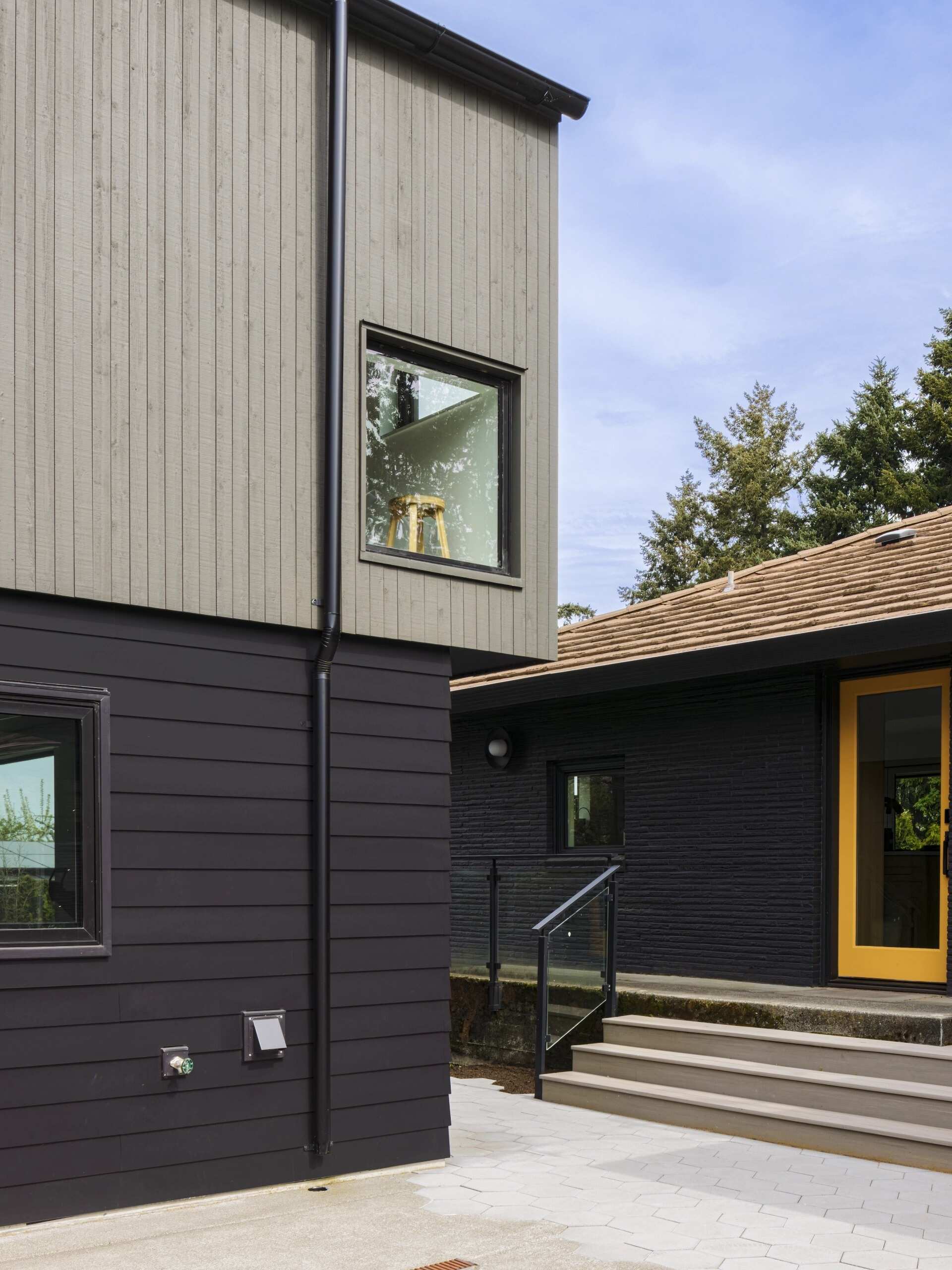 This Seattle garage replacement pairs smart planning with soaring interiors, lake views, and a roof designed with future solar panels in mind.