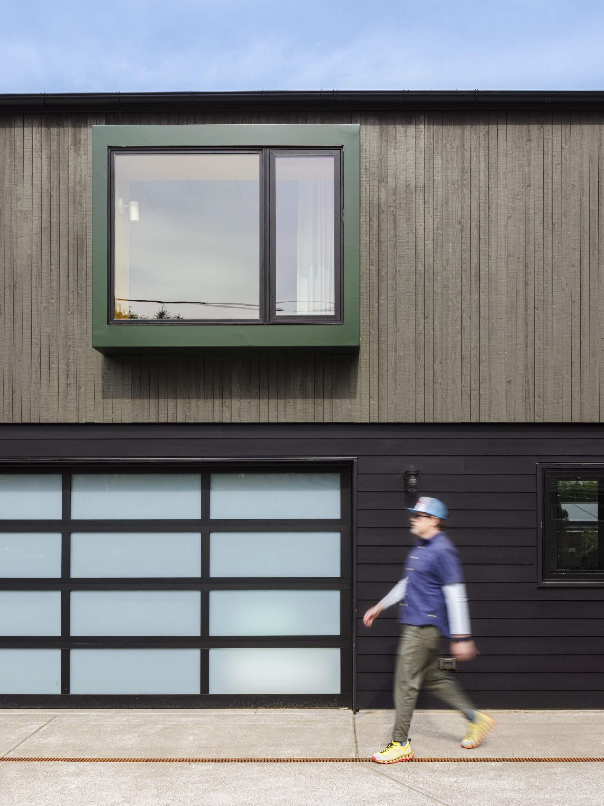 This Seattle garage replacement pairs smart planning with soaring interiors, lake views, and a roof designed with future solar panels in mind.