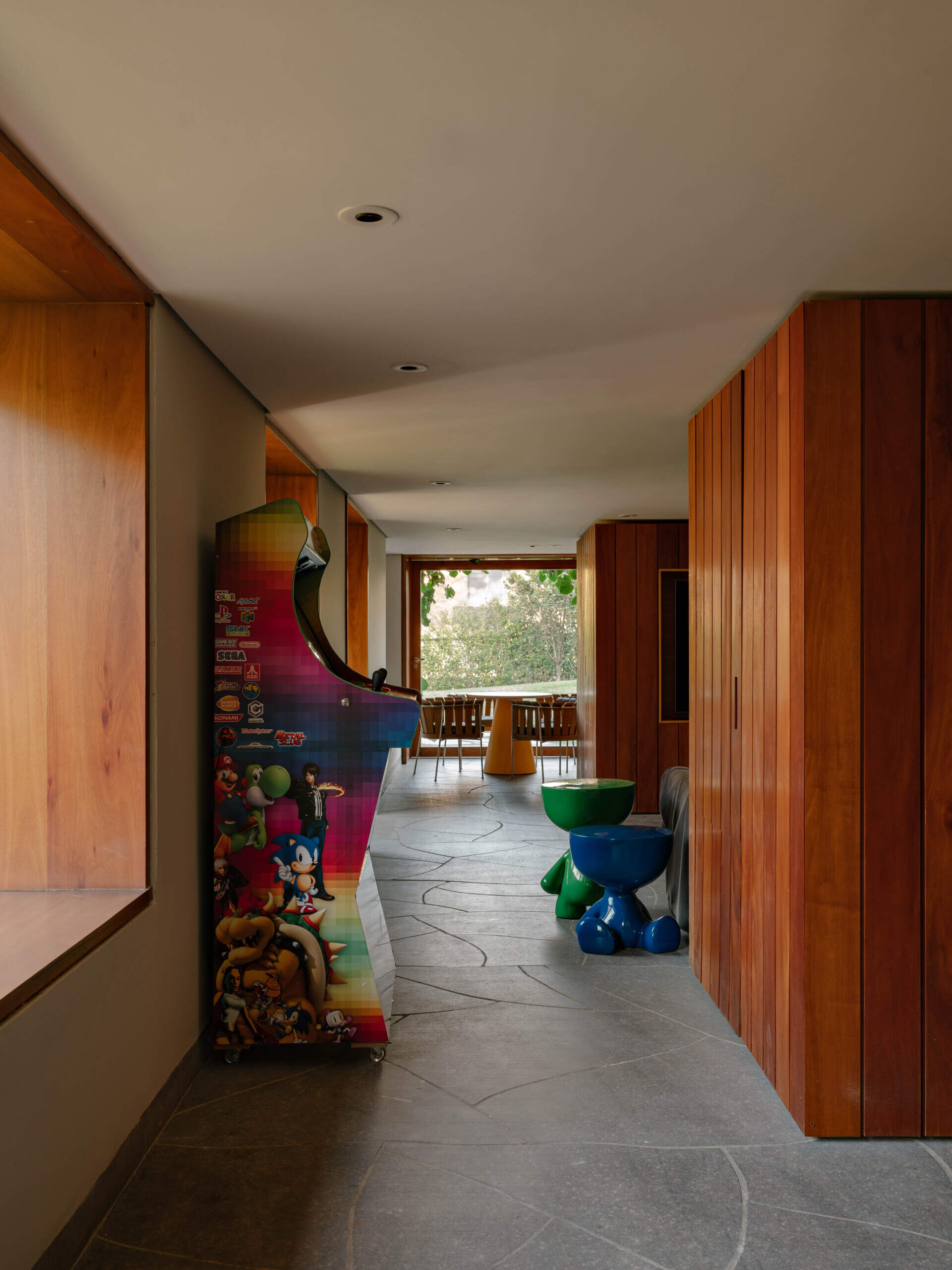 The hall functions as both a gallery and an important link between different areas of the house, leading naturally into the family lounge and nearby living spaces.