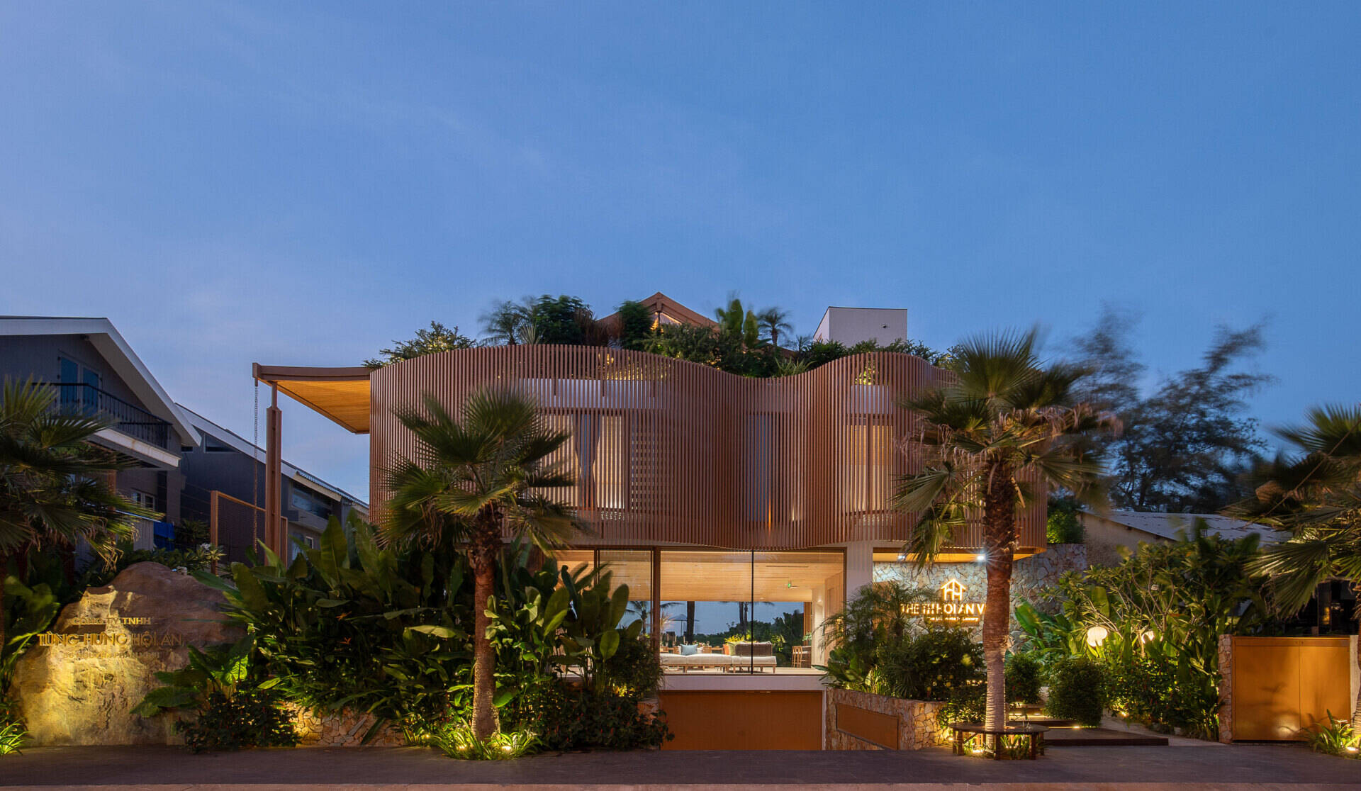 The sculptural façade, basement garage and wave-inspired louver system give TH Villa Hoi An a distinctive coastal identity while responding to the tropical climate.