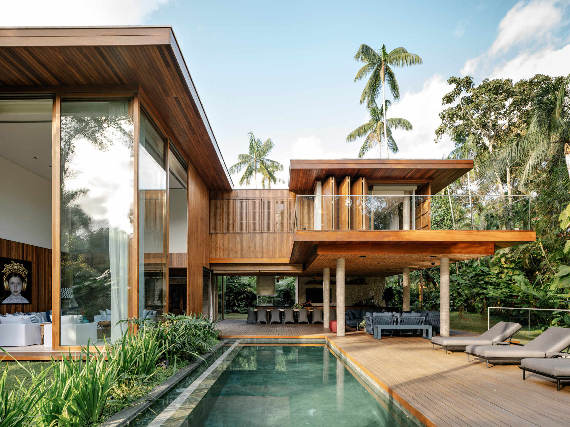 Discover how stone, timber, glass, and clean architectural lines give this Brazilian beach house its timeless street appeal.